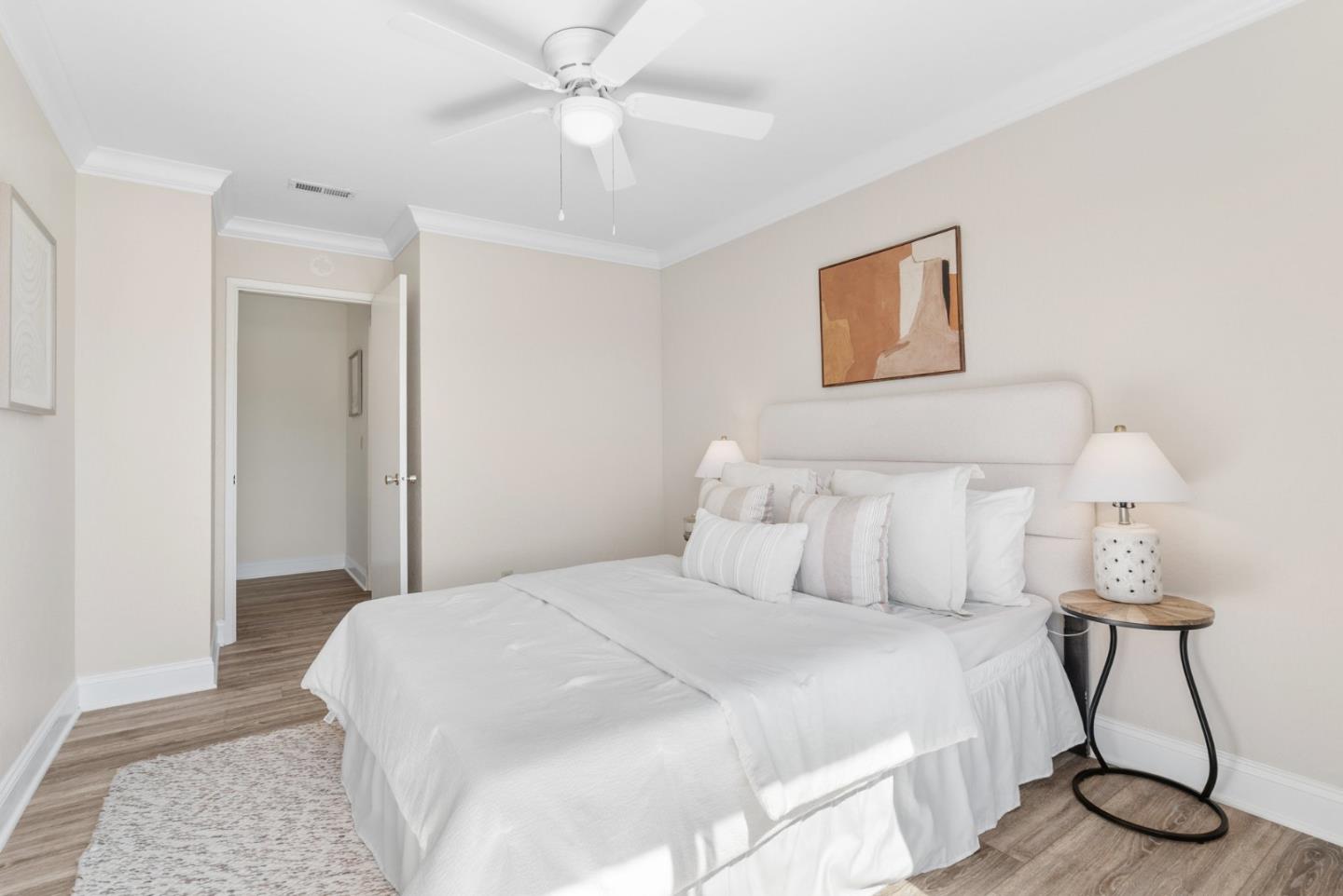 120 Paseo Ballena Aptos, CA 95003 - Photo 39 of 69 a bedroom with a bed and a chandelier