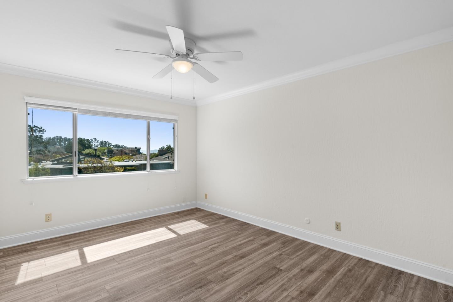 120 Paseo Ballena Aptos, CA 95003 - Photo 47 of 69 a view of an empty room with wooden floor and a window