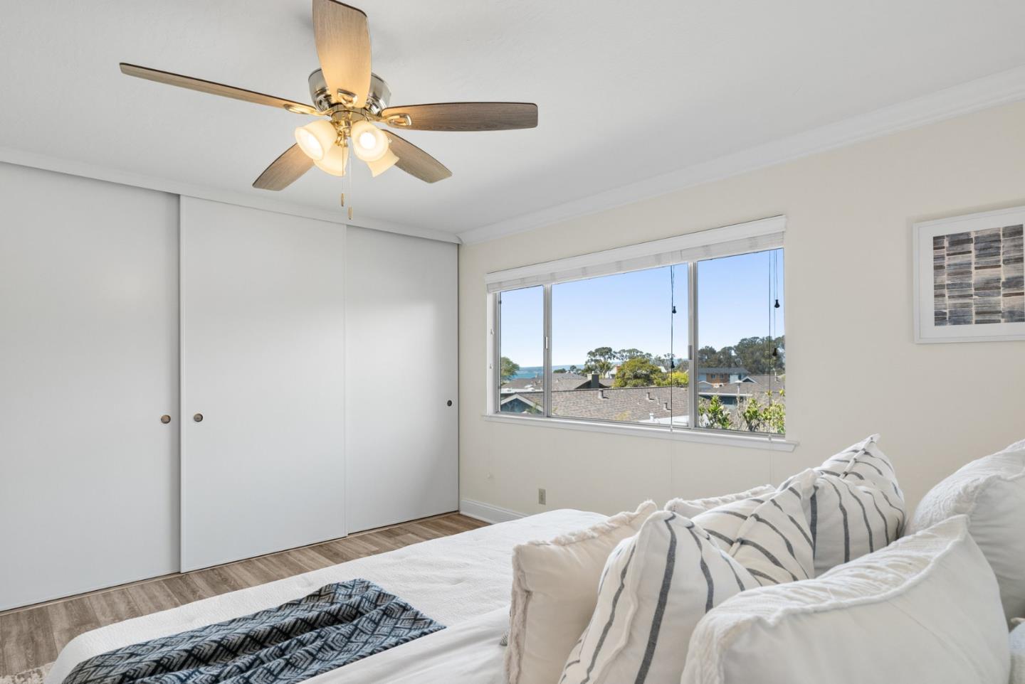 120 Paseo Ballena Aptos, CA 95003 - Photo 50 of 69 a bedroom with a bed and a chandelier fan