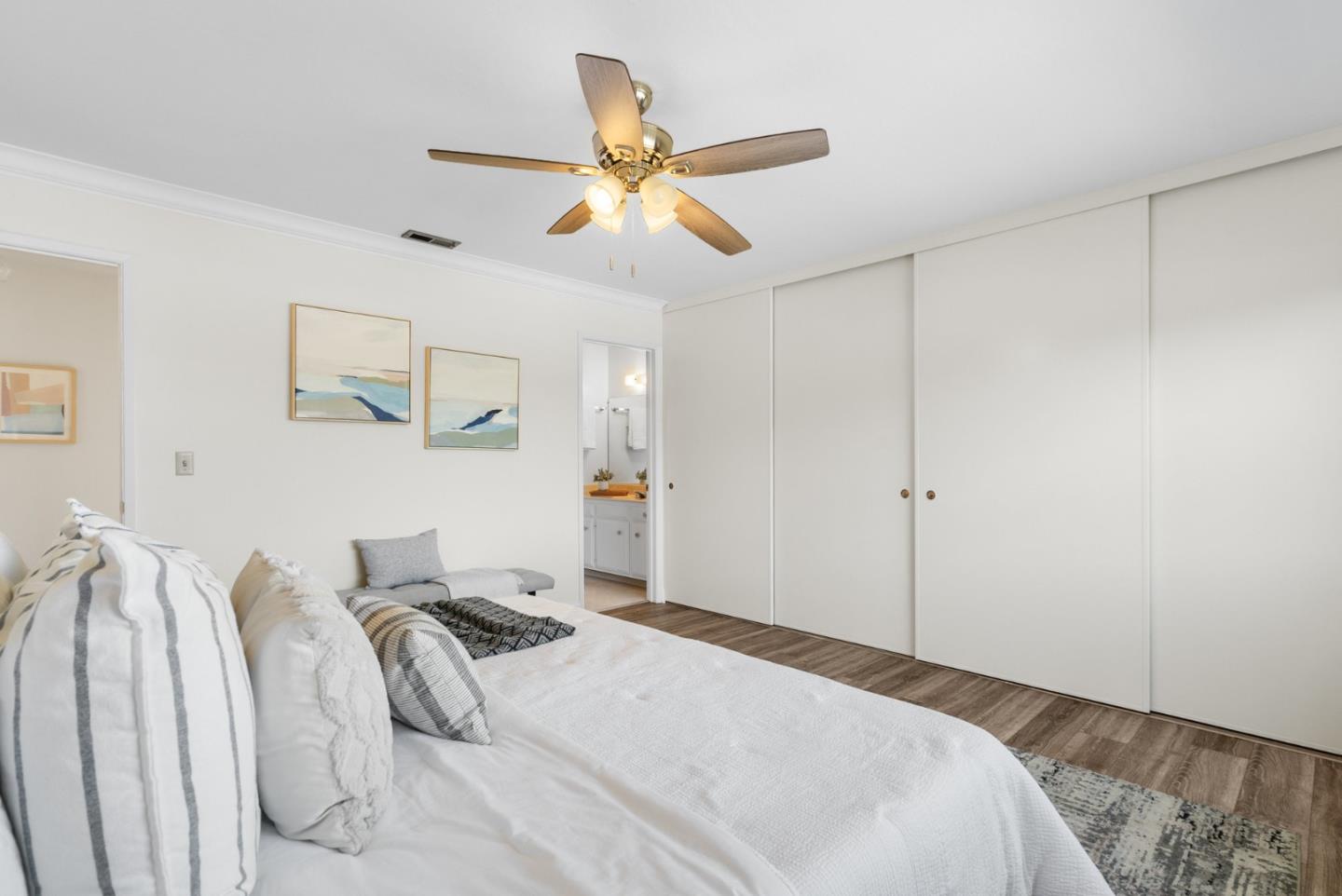 120 Paseo Ballena Aptos, CA 95003 - Photo 54 of 69 a bedroom with a bed and a ceiling fan