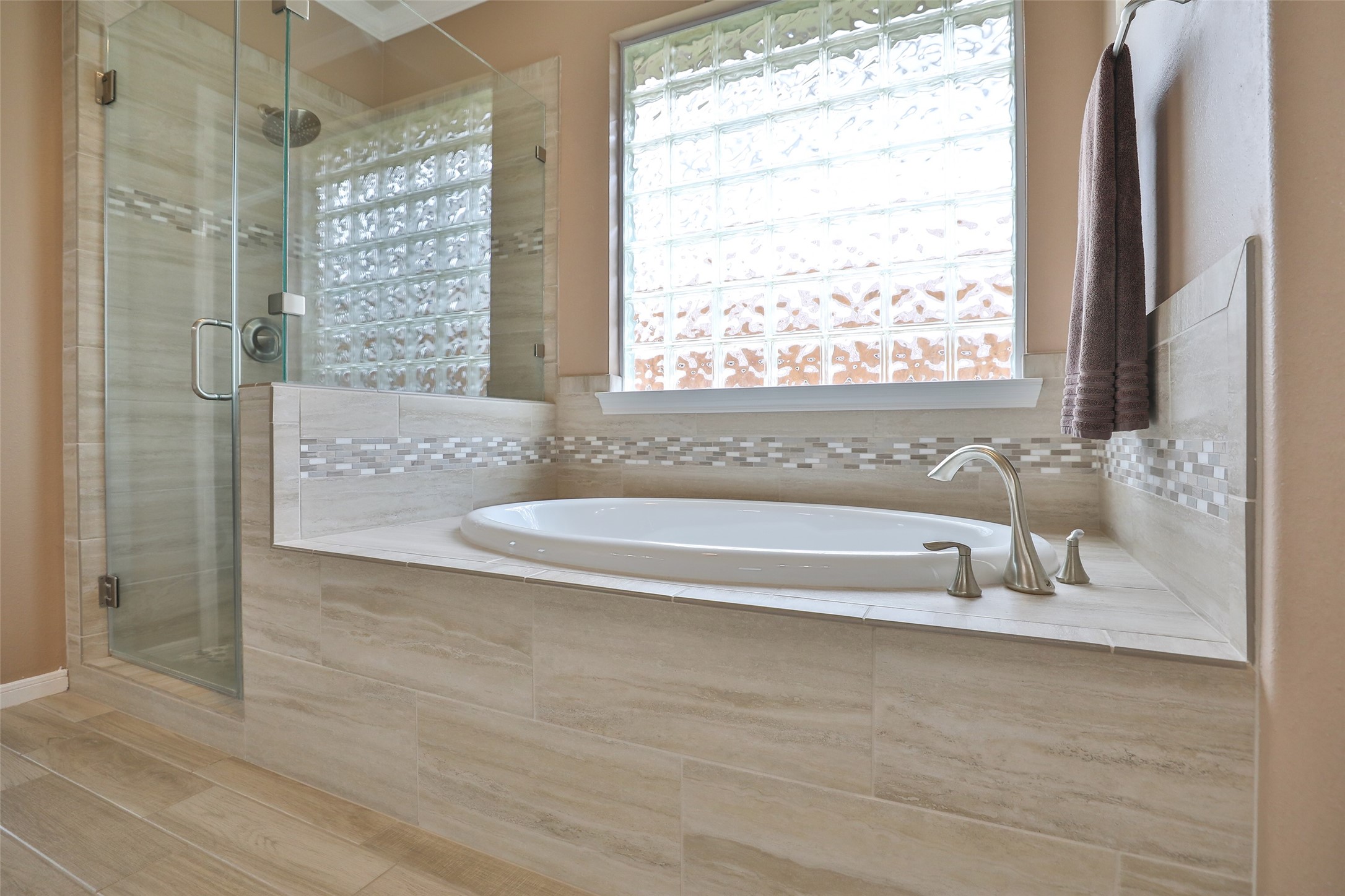 20519 Windrose Bend Drive Spring, TX 77379 - Photo 23 of 37 Luxurious ensuite featuring a modern dual-sink vanities, makeup area, spacious glass-enclosed shower, soaking tub, and walk-in closet.