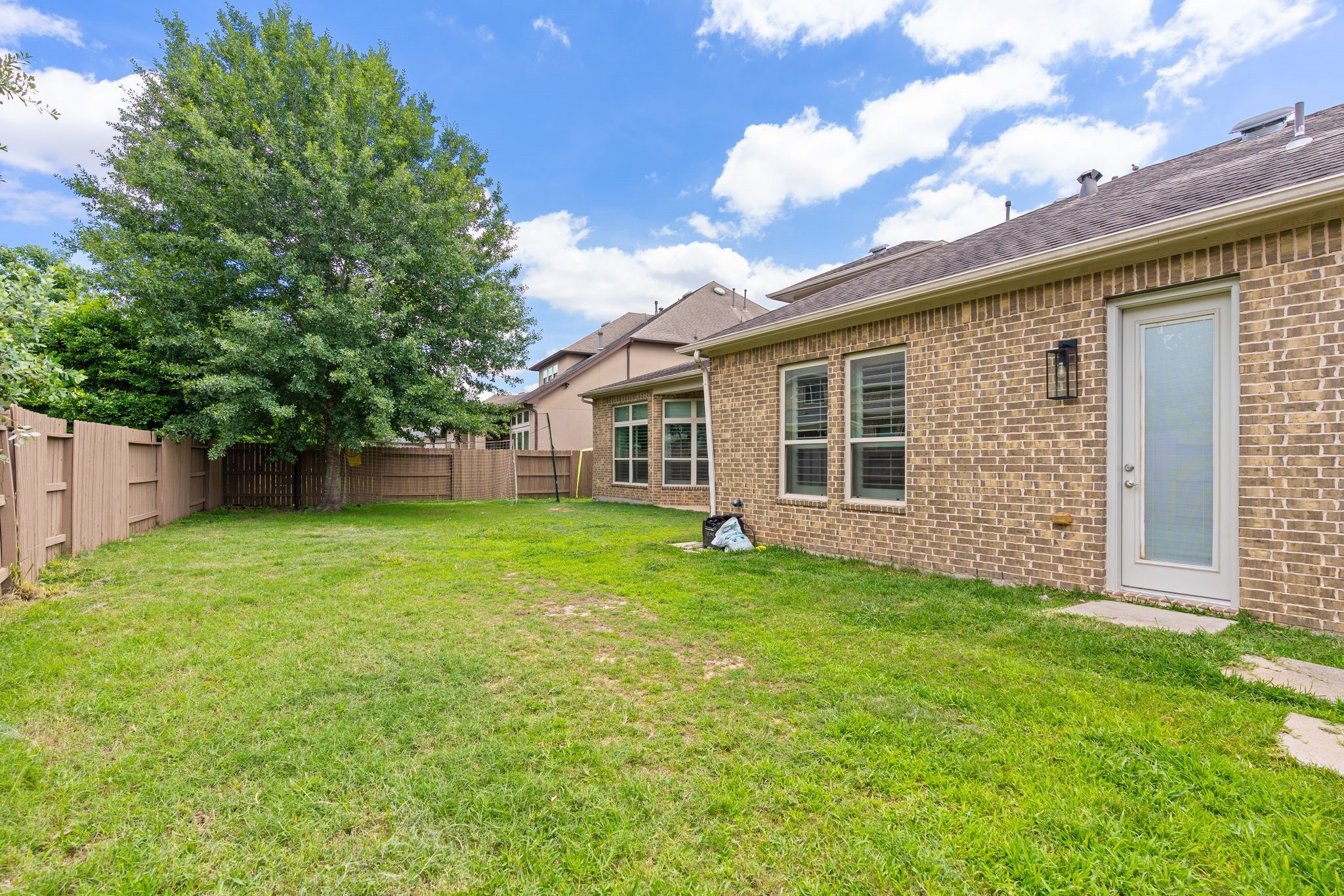 2914 Rutherford Pl Court Katy, TX 77494 - Photo 48 of 50 a view of a backyard with a garden