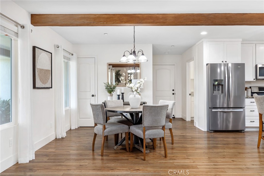 1671 Joshua Tree Lane Fallbrook, CA 92028 - Photo 17 of 44 a view of a dining room with furniture window and wooden floor