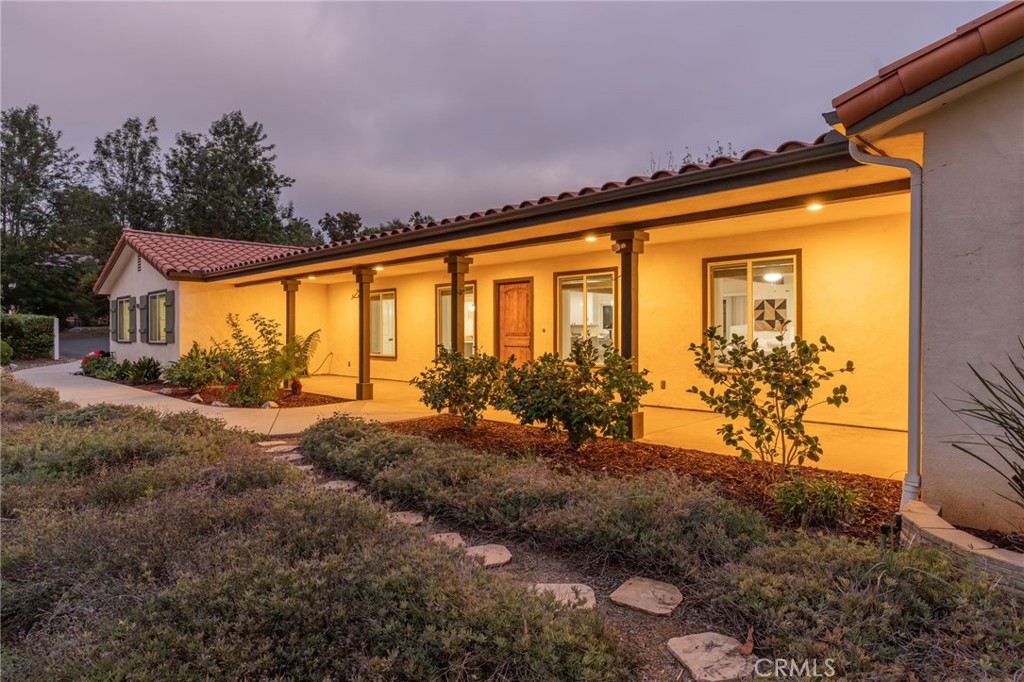 1671 Joshua Tree Lane Fallbrook, CA 92028 - Photo 2 of 44 a front view of a house with a yard
