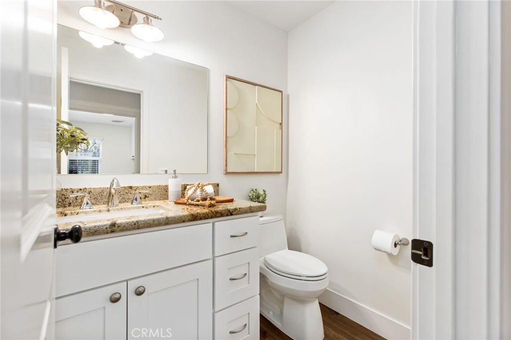 1671 Joshua Tree Lane Fallbrook, CA 92028 - Photo 30 of 44 a bathroom with a toilet a sink a mirror a vanity and shower