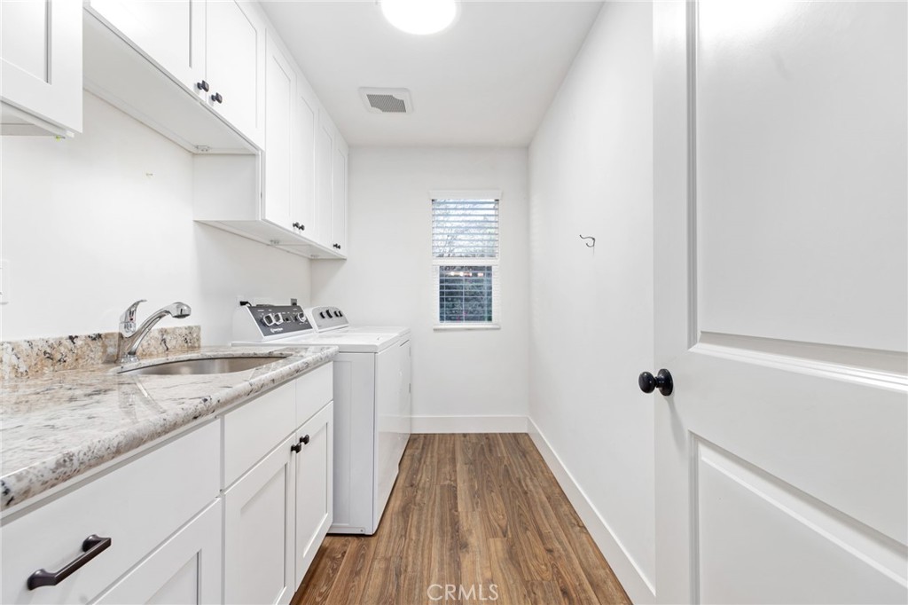 1671 Joshua Tree Lane Fallbrook, CA 92028 - Photo 31 of 44 a kitchen with a sink a window and cabinets