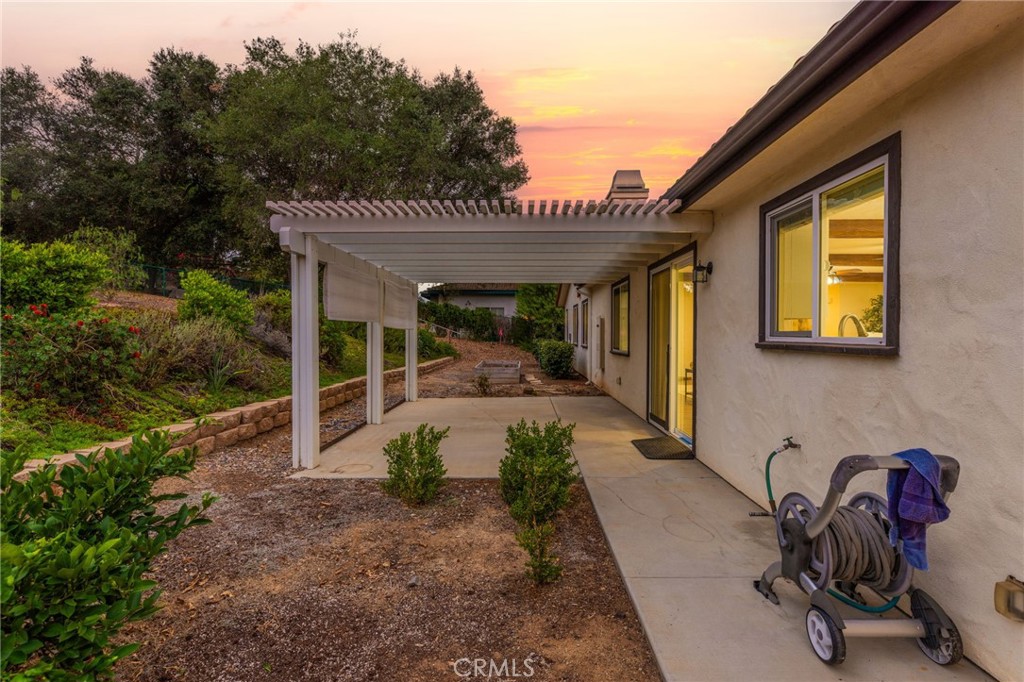 1671 Joshua Tree Lane Fallbrook, CA 92028 - Photo 32 of 44 a view of a patio with table and chairs and potted plants