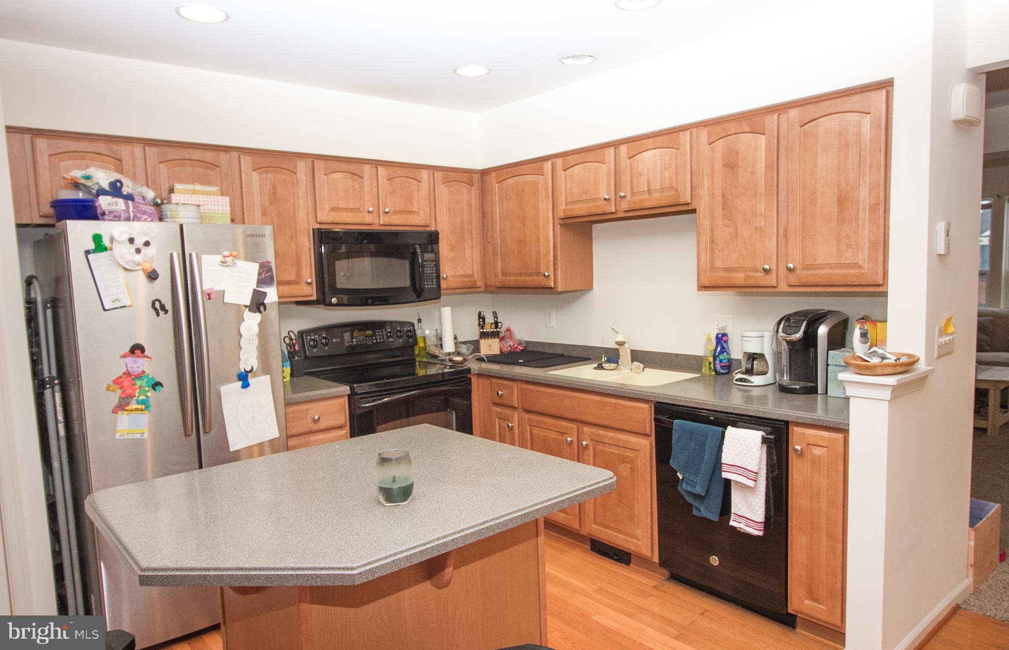 1253 Steed Street Ranson, WV 25438 - Photo 11 of 18 a kitchen with stainless steel appliances granite countertop a refrigerator a stove top oven a sink and dishwasher