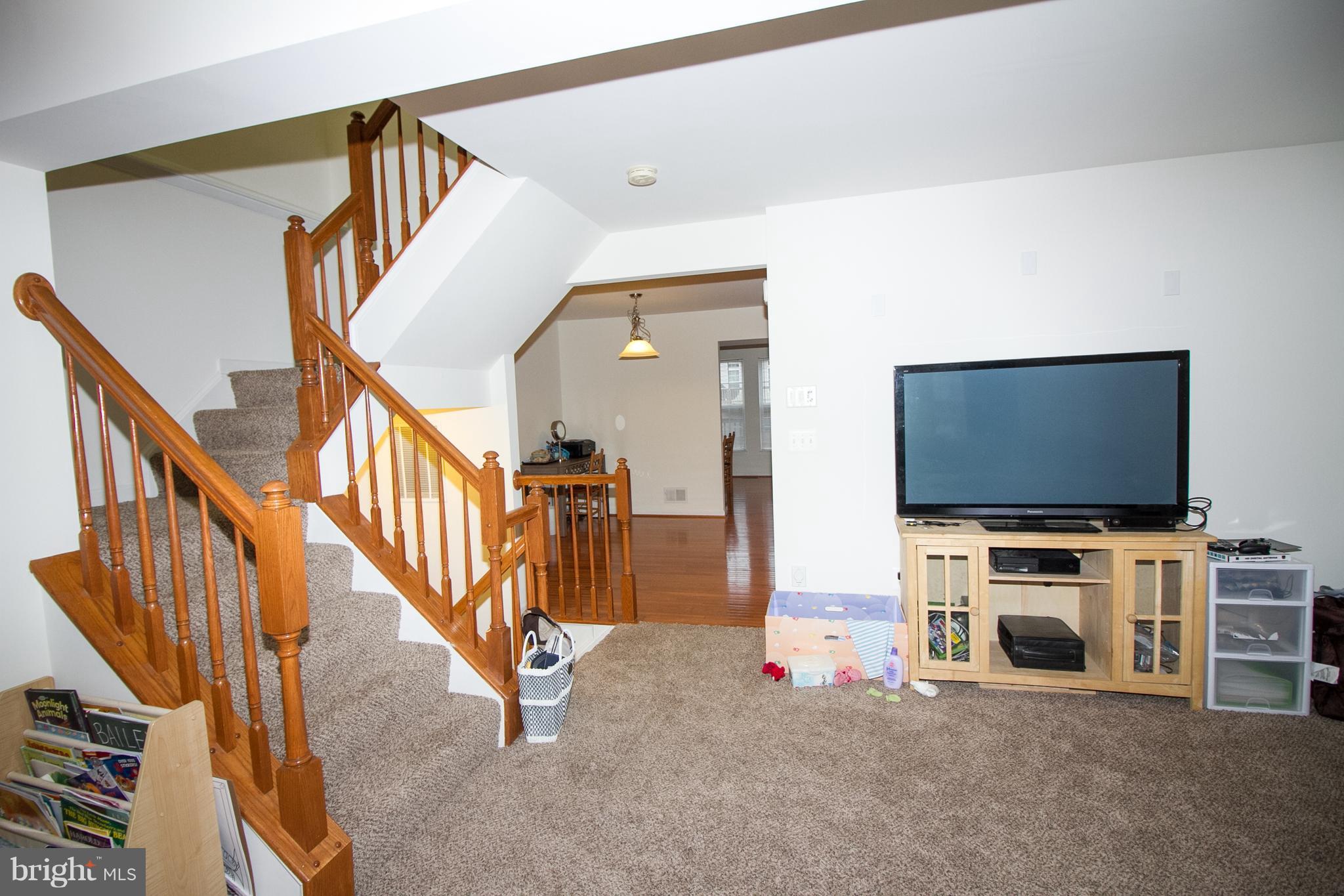 1253 Steed Street Ranson, WV 25438 - Photo 14 of 18 a view of livingroom with furniture and a flat screen tv