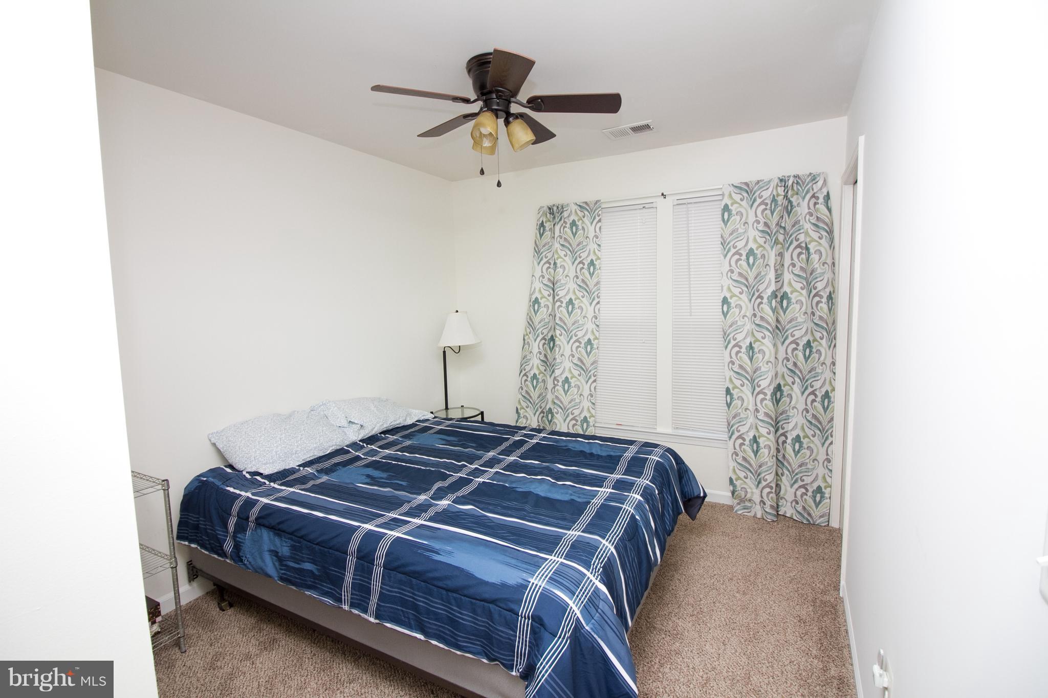 1253 Steed Street Ranson, WV 25438 - Photo 17 of 18 a bedroom with a bed and a ceiling fan