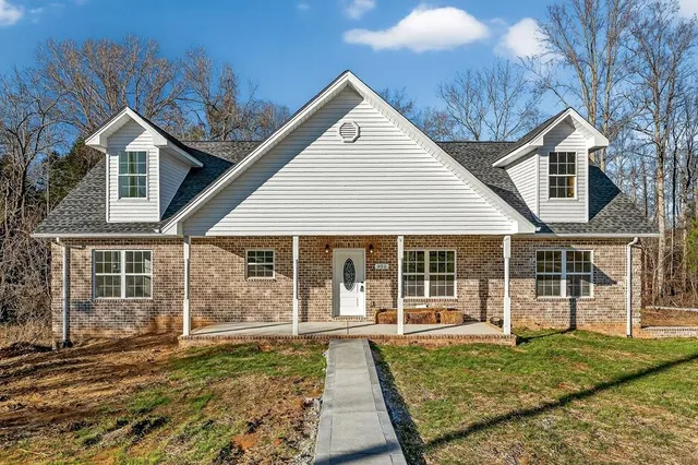 front view of a house with a yard