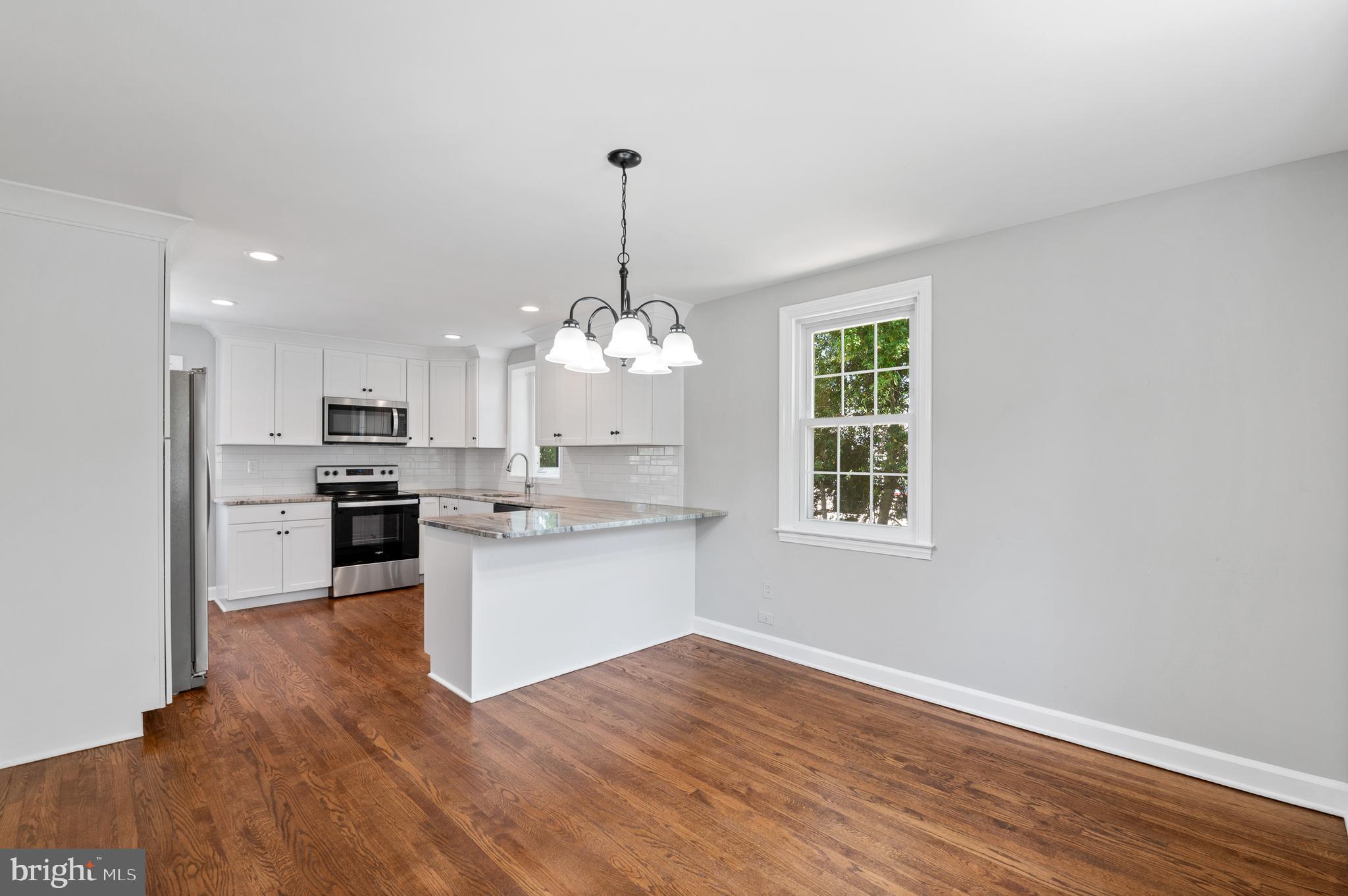 3731 School Lane Newtown Square, PA 19073 - Photo 11 of 31 a open kitchen with granite countertop stainless steel appliances sink and cabinets