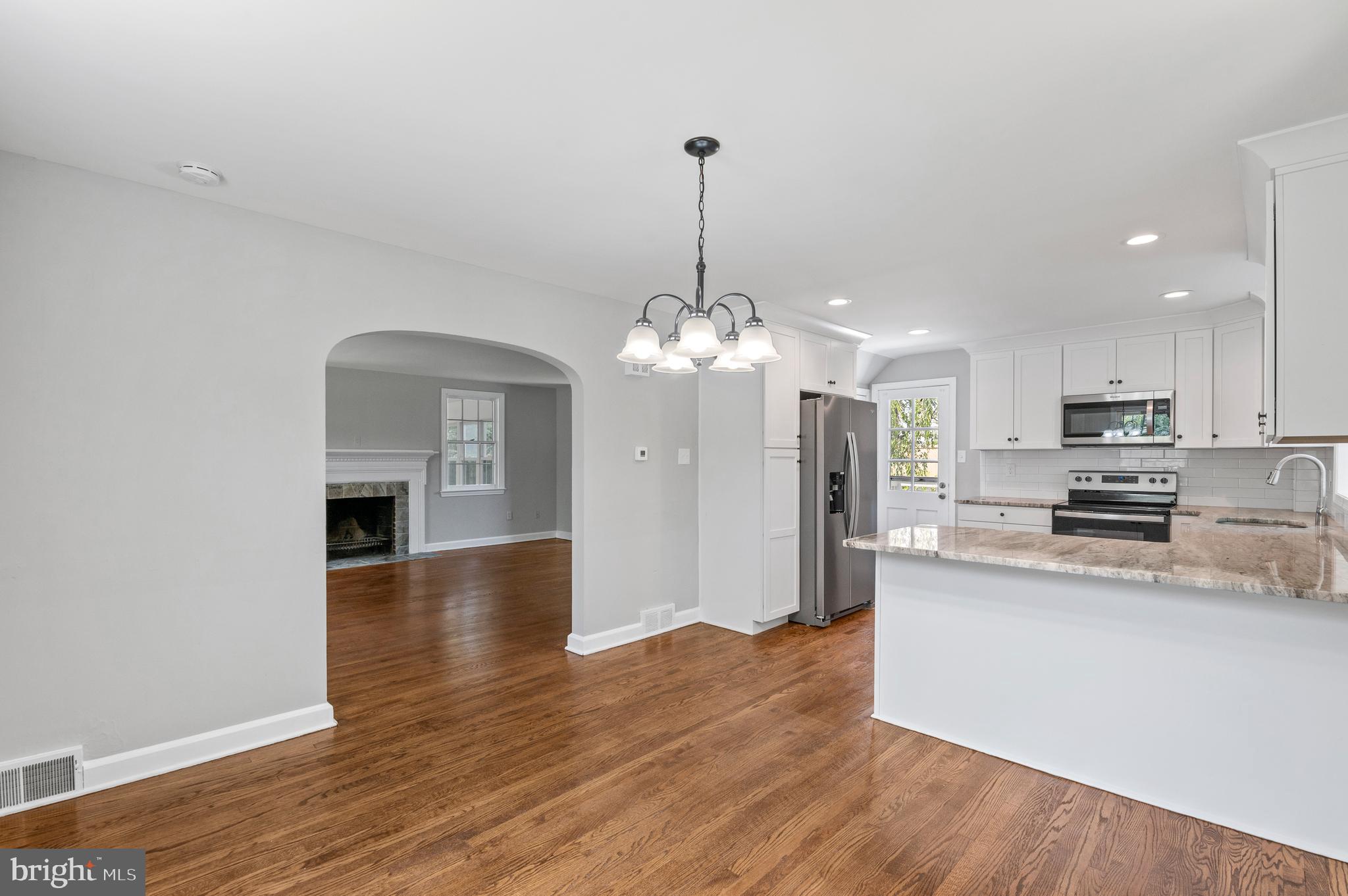 3731 School Lane Newtown Square, PA 19073 - Photo 12 of 31 a view of a kitchen with granite countertop stainless steel appliances and wooden floor