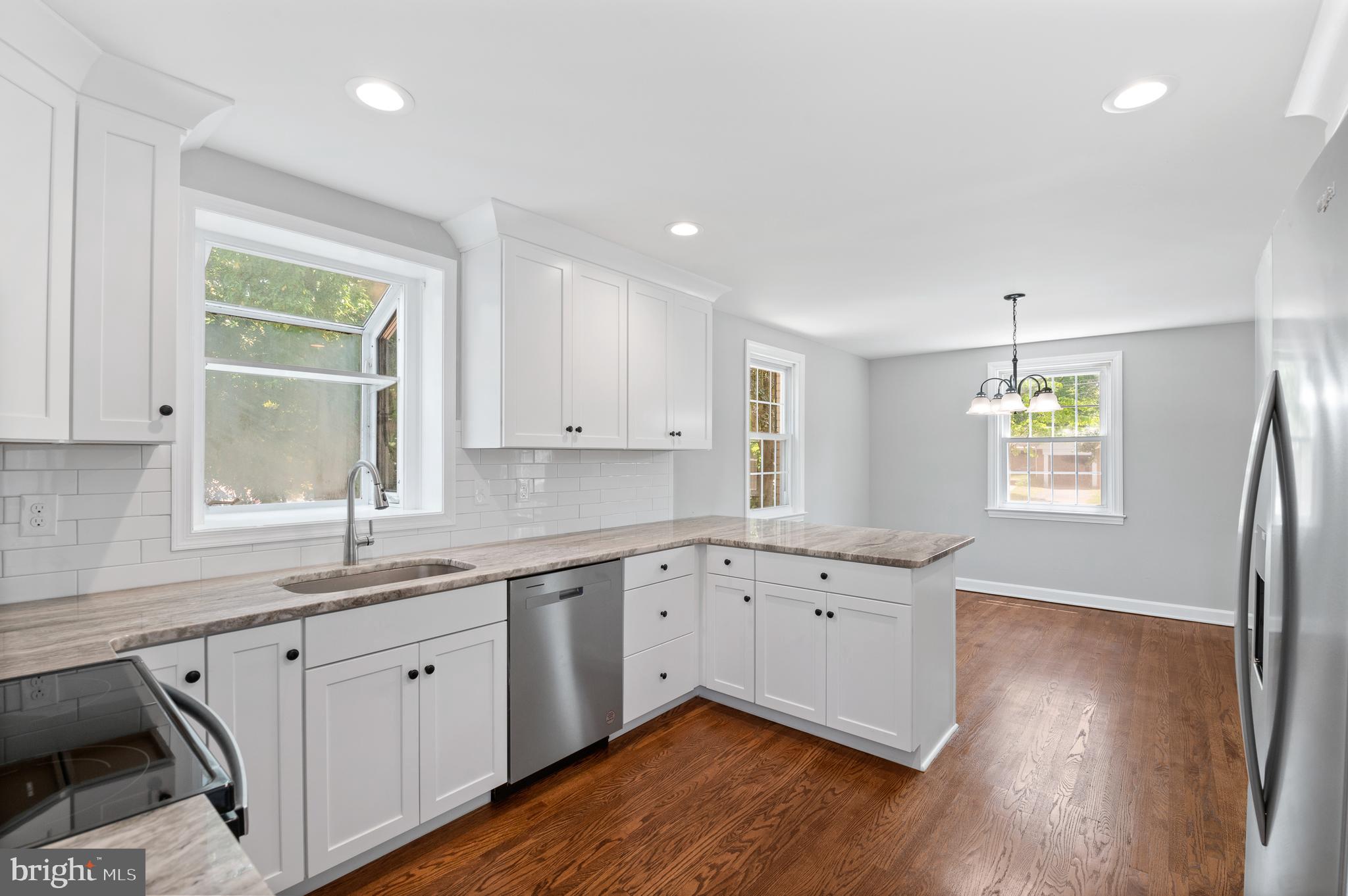 3731 School Lane Newtown Square, PA 19073 - Photo 14 of 31 a kitchen with a sink wooden floor and window
