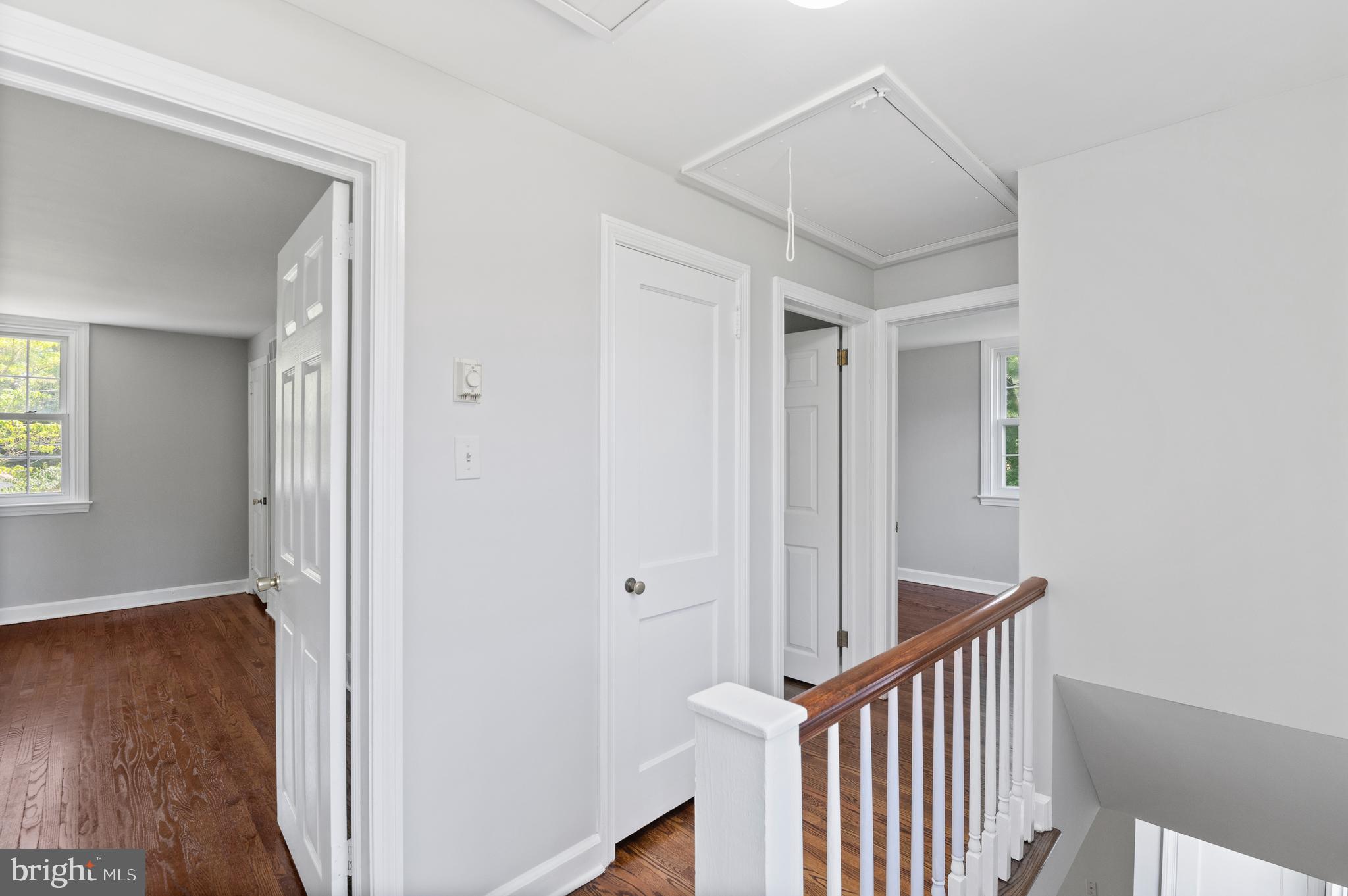 3731 School Lane Newtown Square, PA 19073 - Photo 16 of 31 a view of a hallway with wooden floor and a bathroom