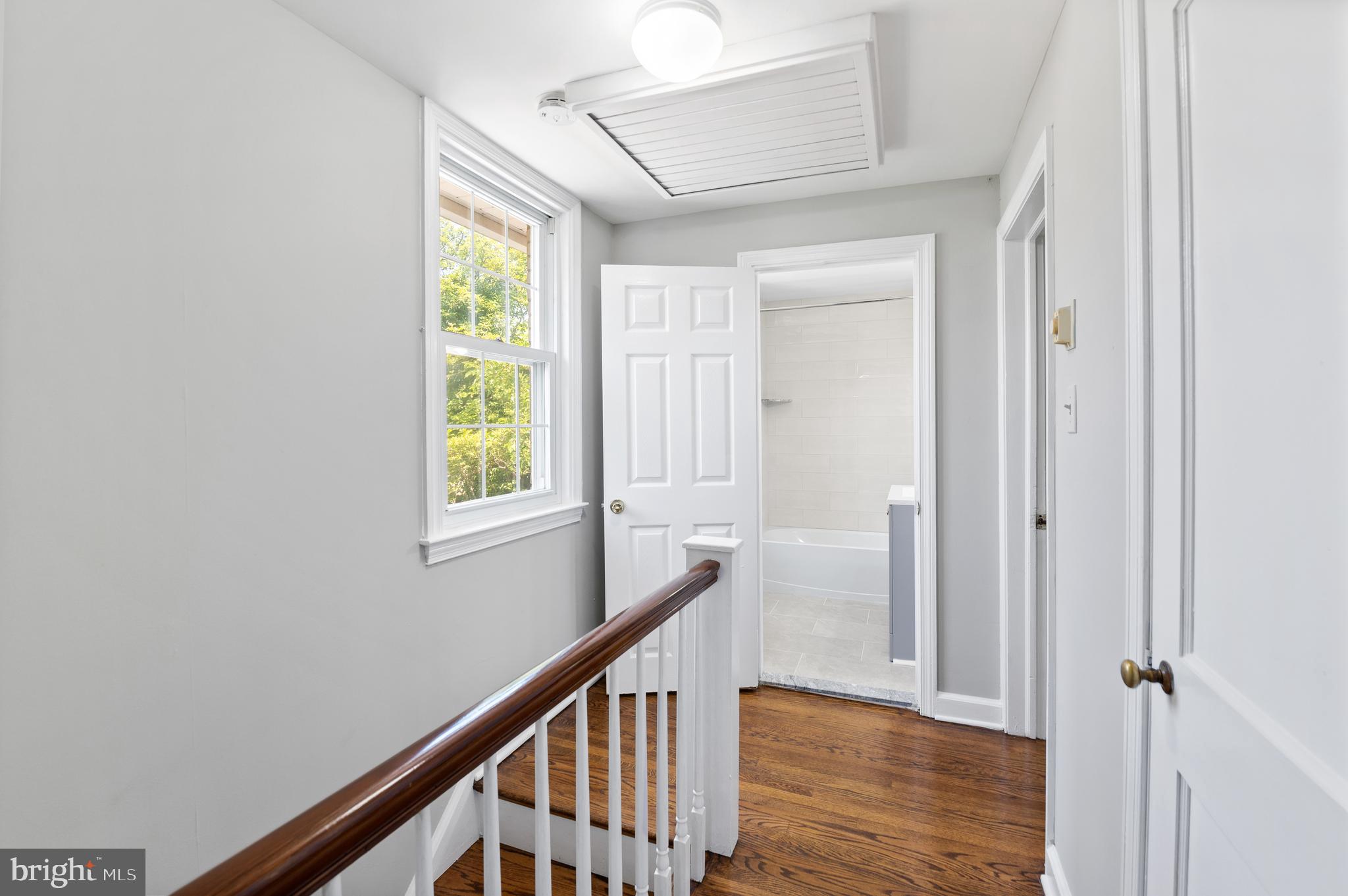 3731 School Lane Newtown Square, PA 19073 - Photo 17 of 31 a view of a hallway with wooden floor and staircase