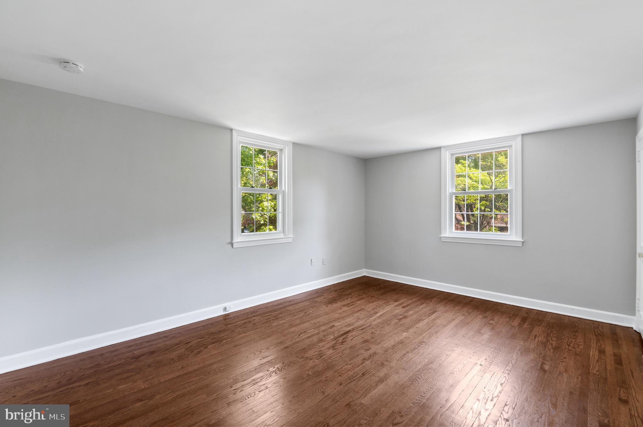 3731 School Lane Newtown Square, PA 19073 - Photo 19 of 31 a view of an empty room with wooden floor and a window