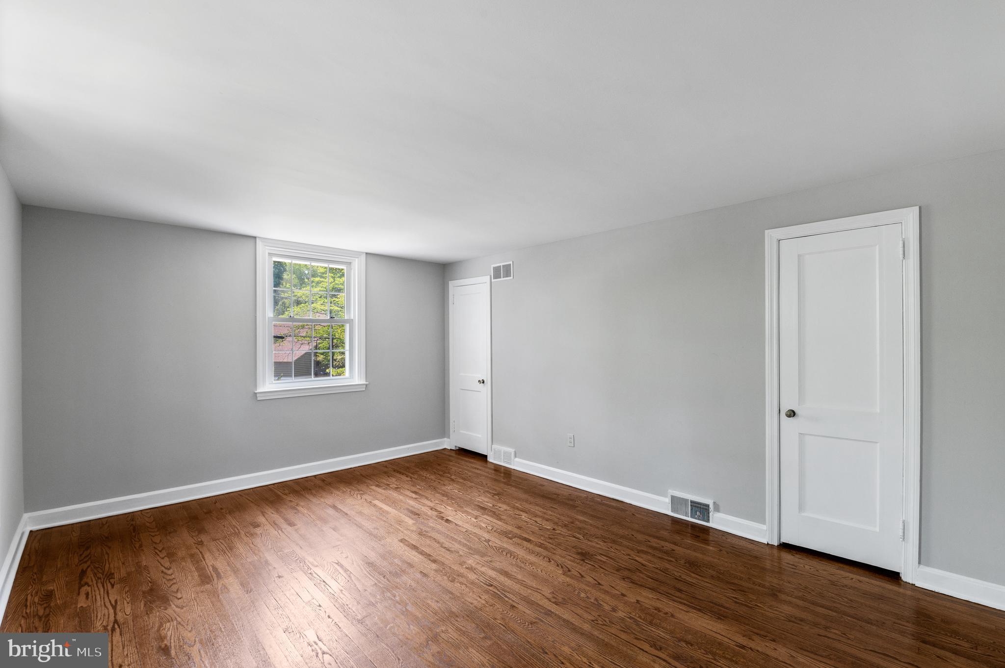 3731 School Lane Newtown Square, PA 19073 - Photo 20 of 31 an empty room with wooden floor and window