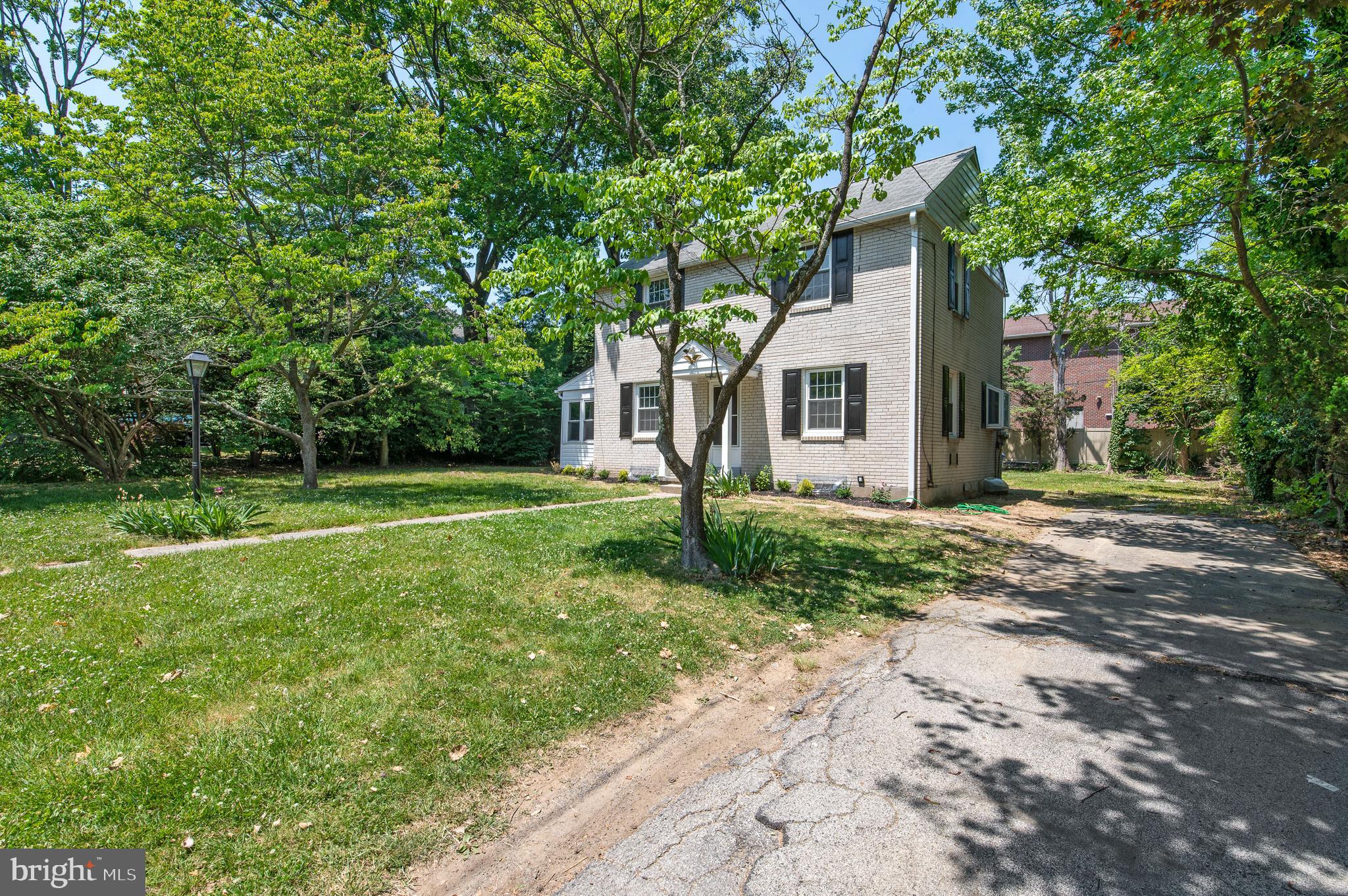 3731 School Lane Newtown Square, PA 19073 - Photo 2 of 31 a front view of a house with yard and green space