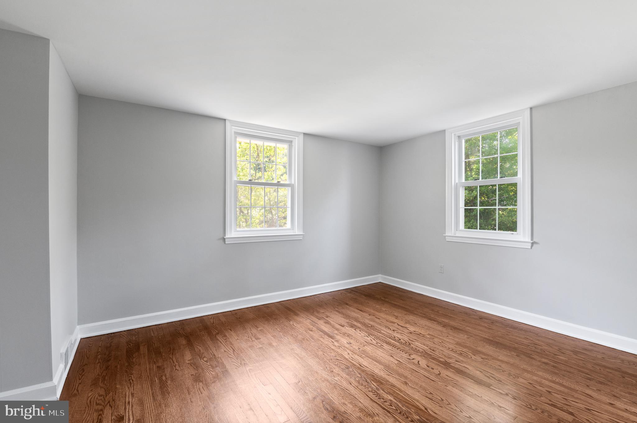 3731 School Lane Newtown Square, PA 19073 - Photo 22 of 31 a view of a room with wooden floor and windows