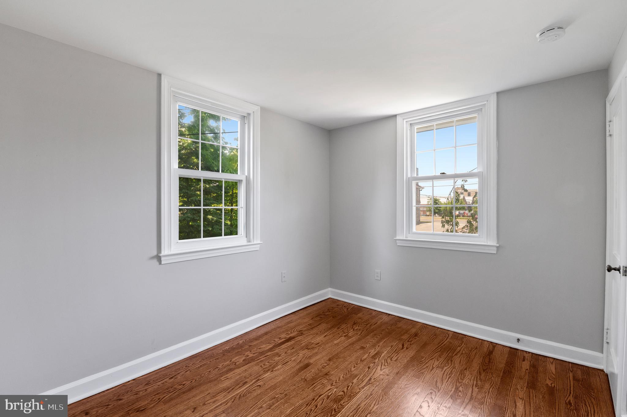 3731 School Lane Newtown Square, PA 19073 - Photo 24 of 31 a view of an empty room with wooden floor and a window