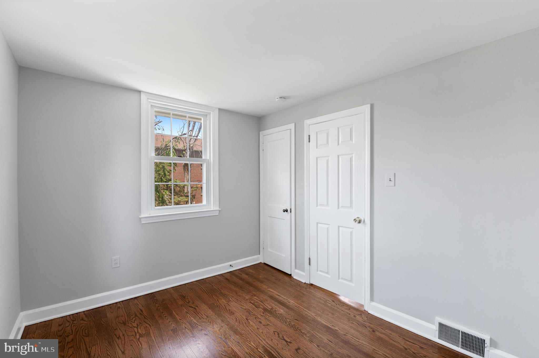 3731 School Lane Newtown Square, PA 19073 - Photo 25 of 31 an empty room with wooden floor and windows