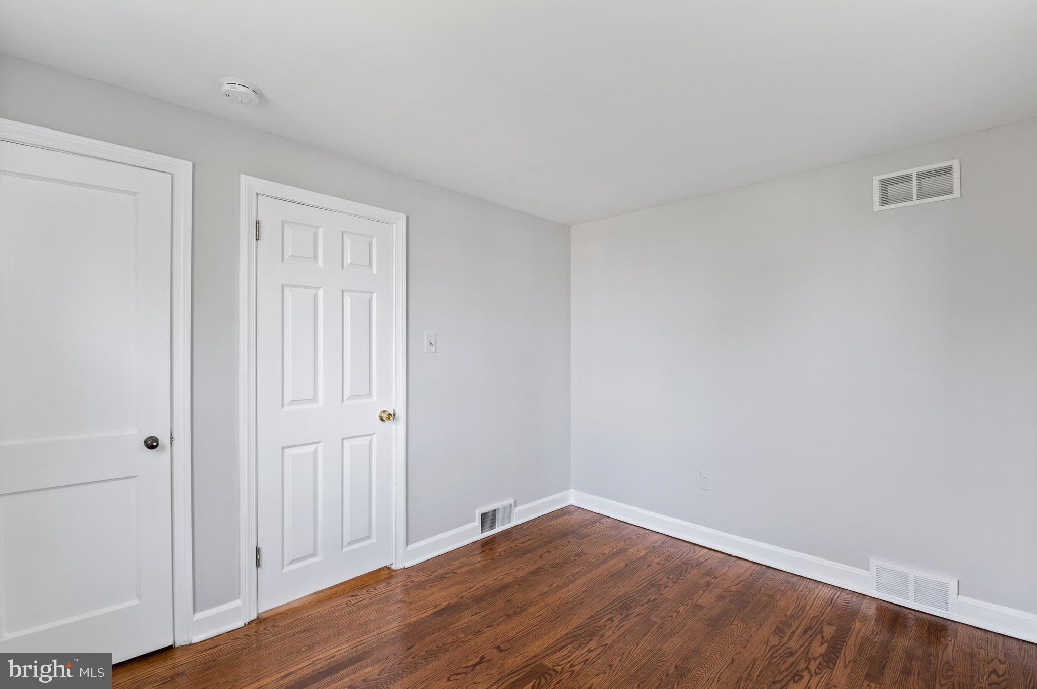 3731 School Lane Newtown Square, PA 19073 - Photo 26 of 31 a view of an empty room with wooden floor