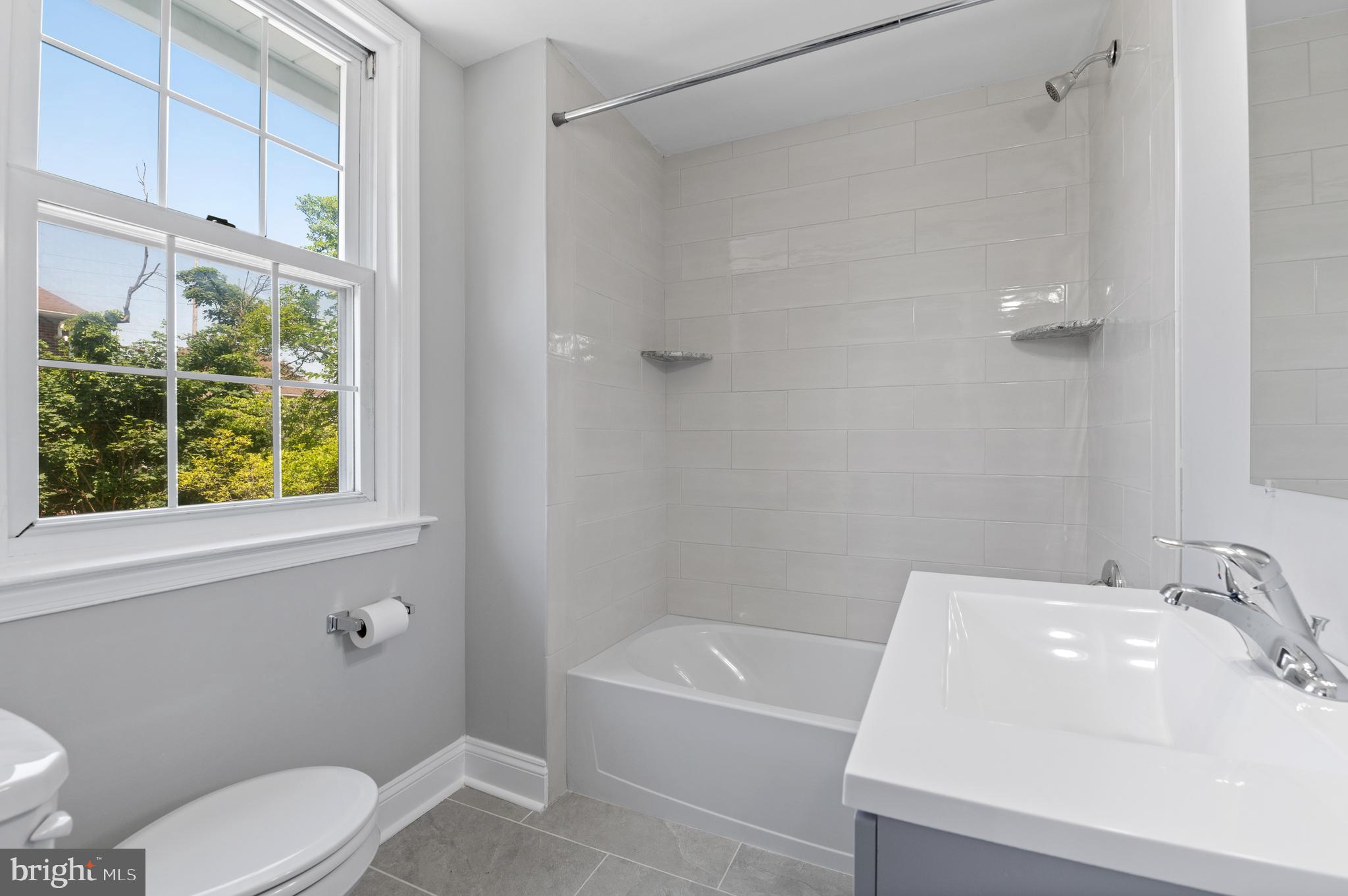 3731 School Lane Newtown Square, PA 19073 - Photo 27 of 31 a bathroom with a sink toilet and shower