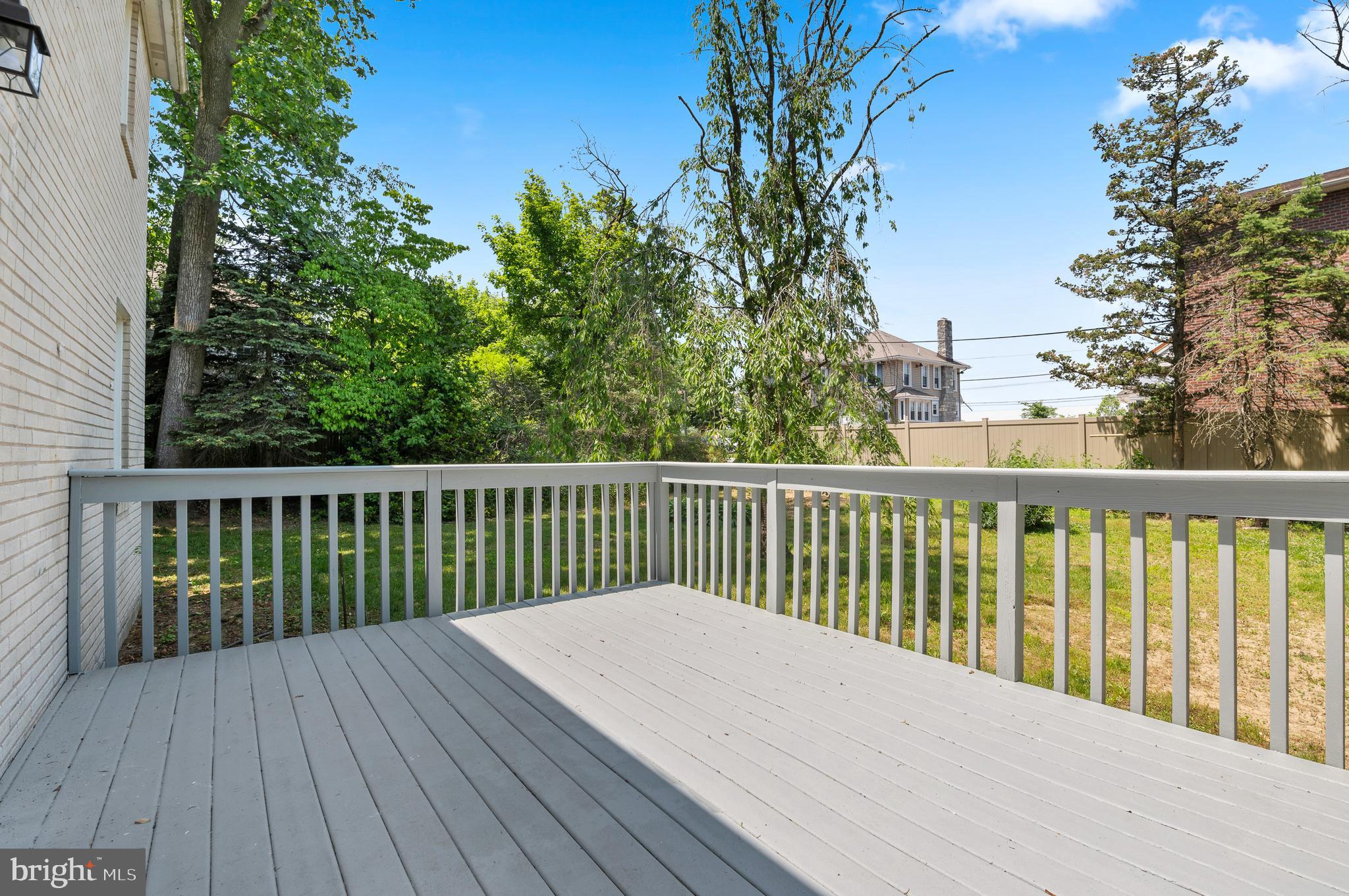 3731 School Lane Newtown Square, PA 19073 - Photo 4 of 31 a balcony with wooden floor and fence