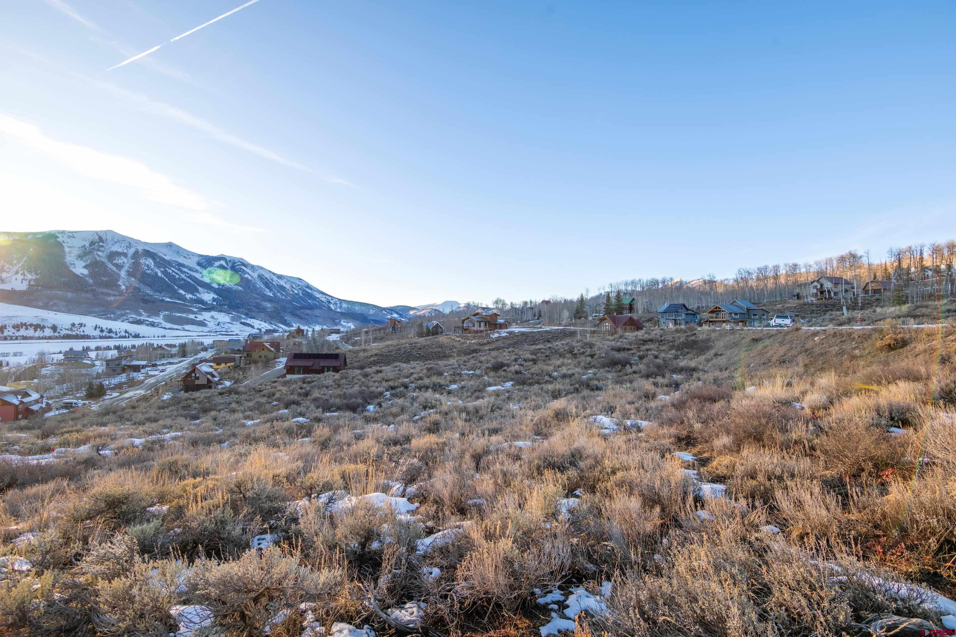 226 Cisneros Lane Crested Butte, CO 81224 - Photo 9 of 22 a view of a large mountain with trees in the background