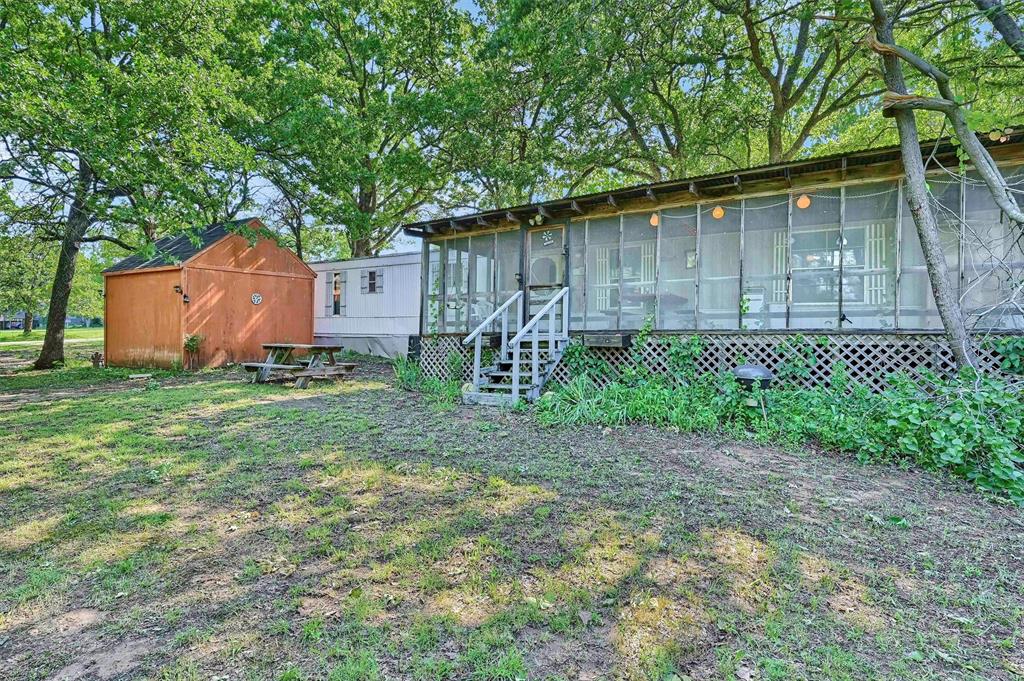 36 Atlantic Street Pottsboro, TX 75076 - Photo 20 of 21 Back of house featuring a sunroom