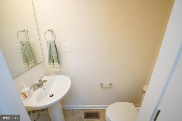 a large kitchen with a table and chairs in it