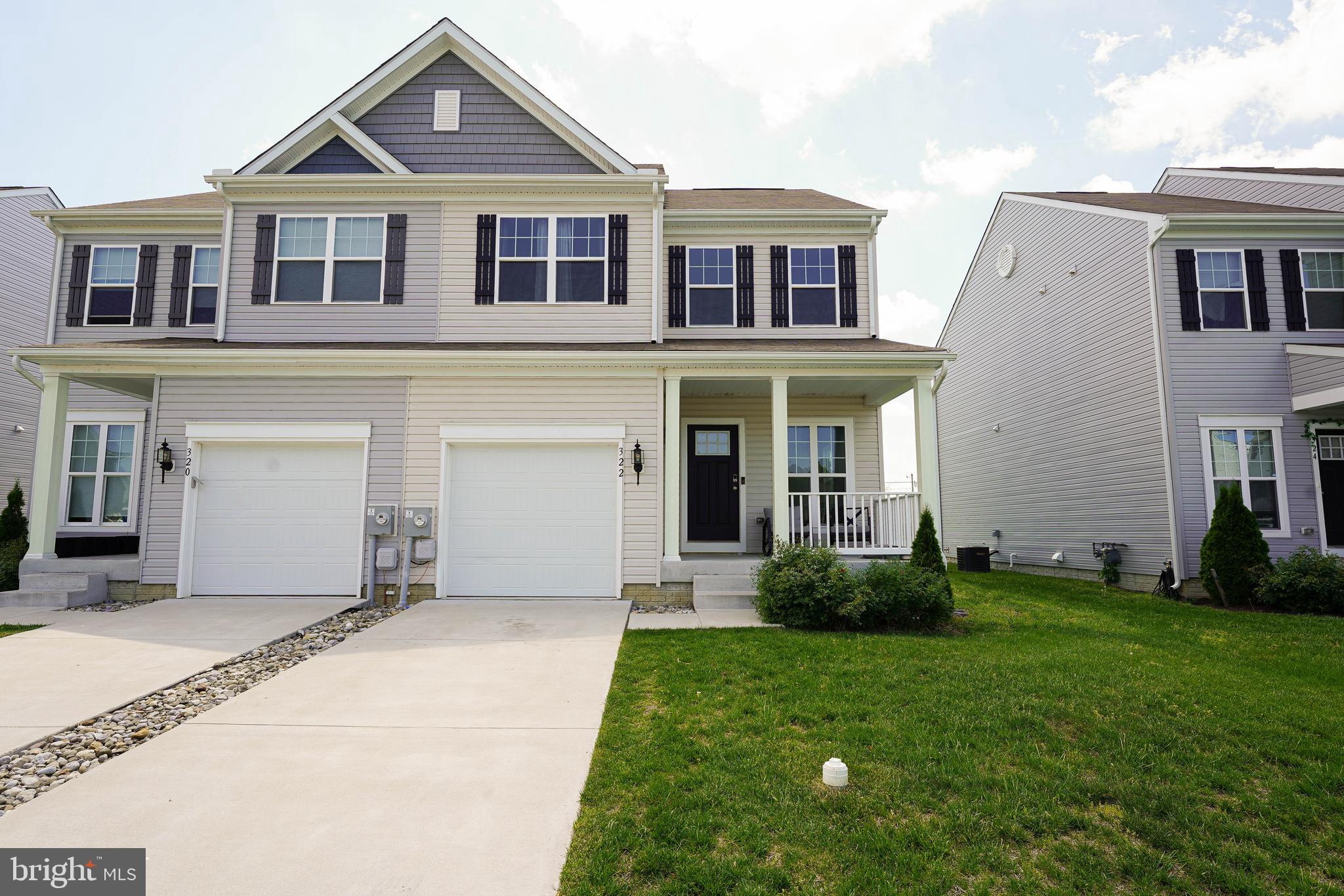 322 Appleby School Road Cambridge, MD 21613 - Photo 2 of 58 a front view of a house with a yard and porch