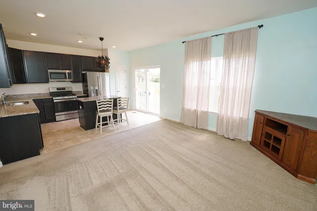 a kitchen with stainless steel appliances granite countertop a sink and a granite counter tops