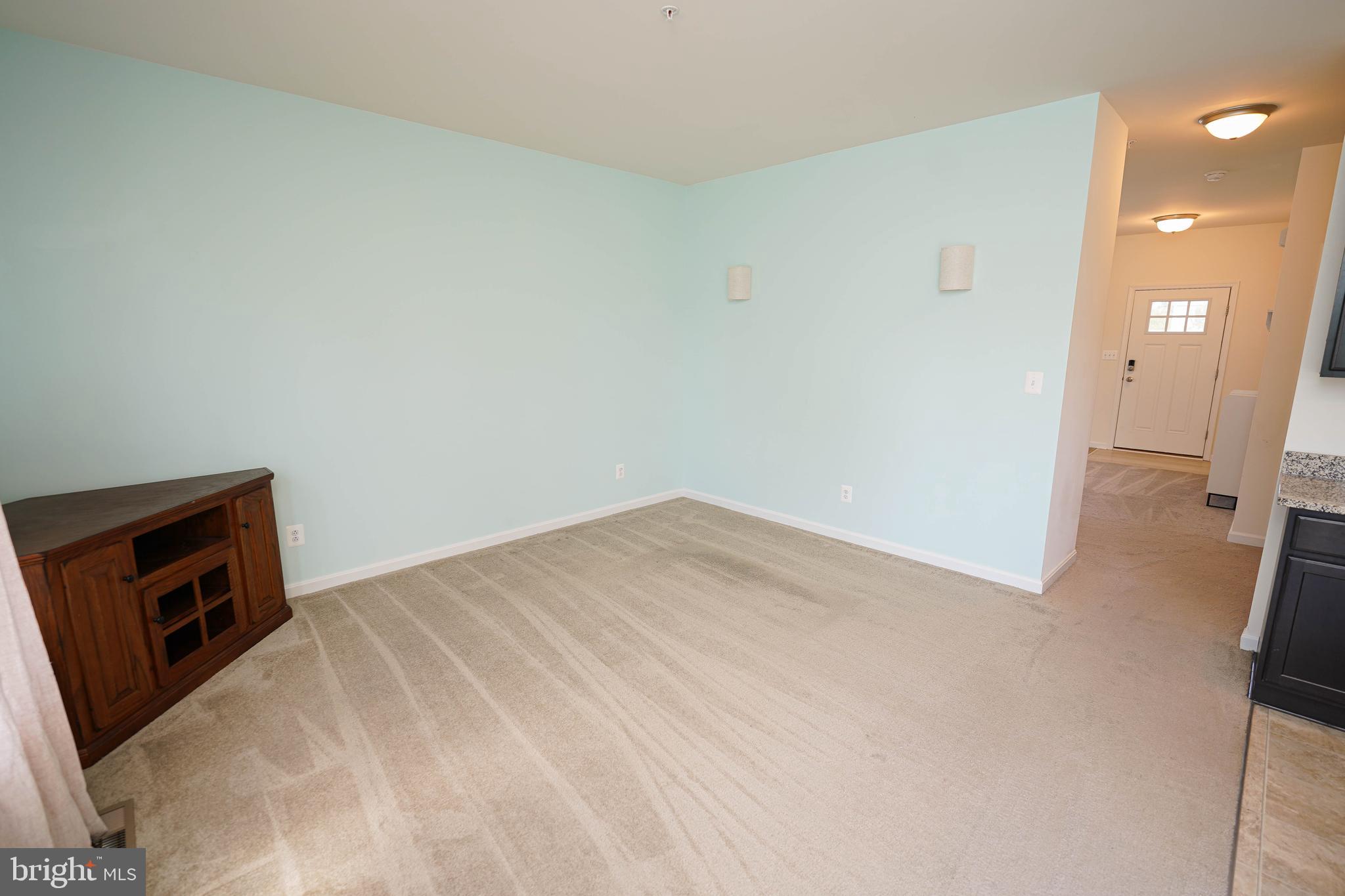 322 Appleby School Road Cambridge, MD 21613 - Photo 26 of 58 a view of empty room with wooden floor and fireplace