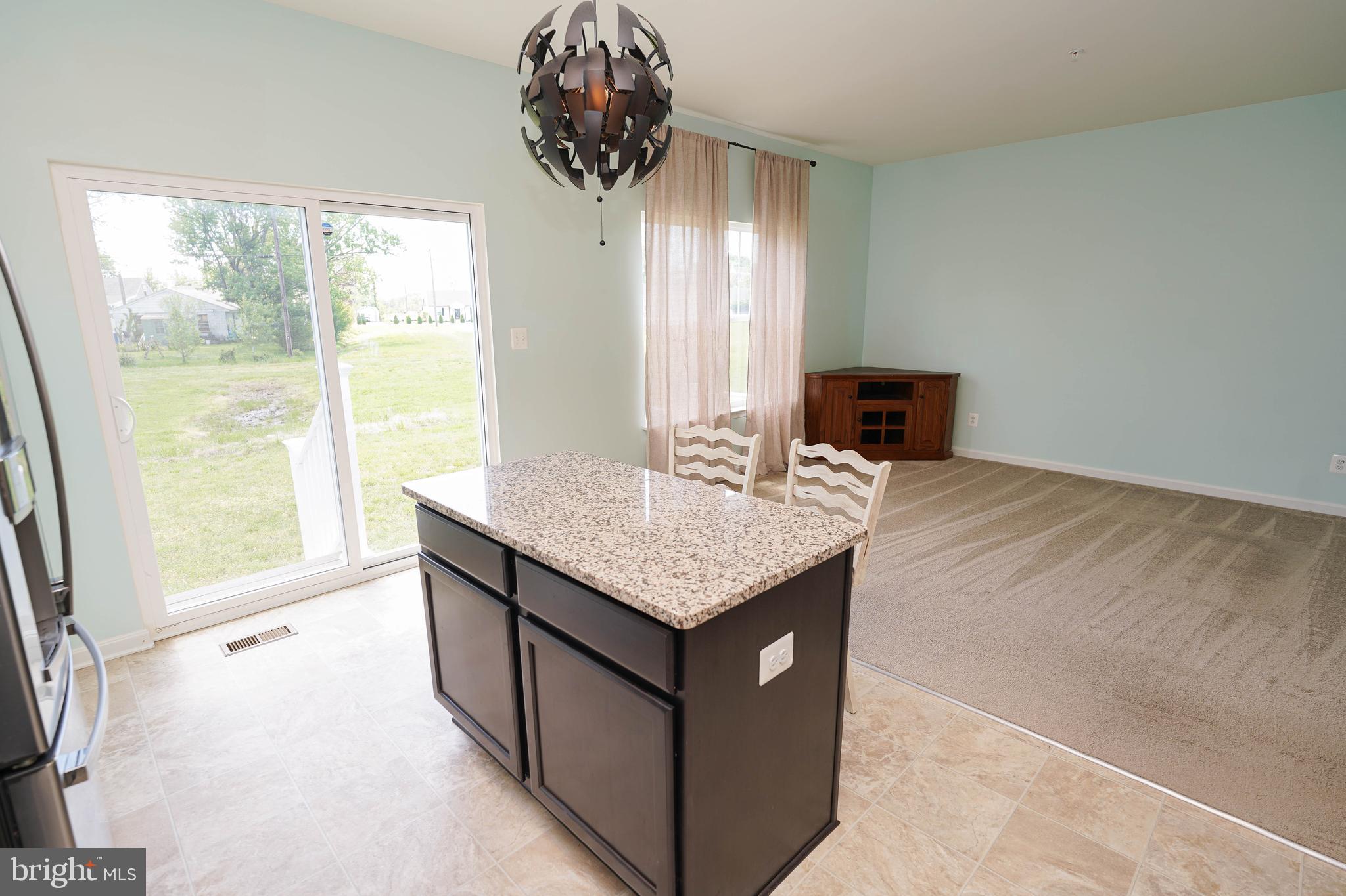 322 Appleby School Road Cambridge, MD 21613 - Photo 30 of 58 a kitchen with stainless steel appliances granite countertop a sink and a granite counter tops