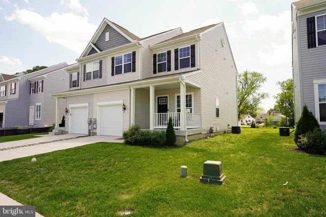 front view of a house with a yard