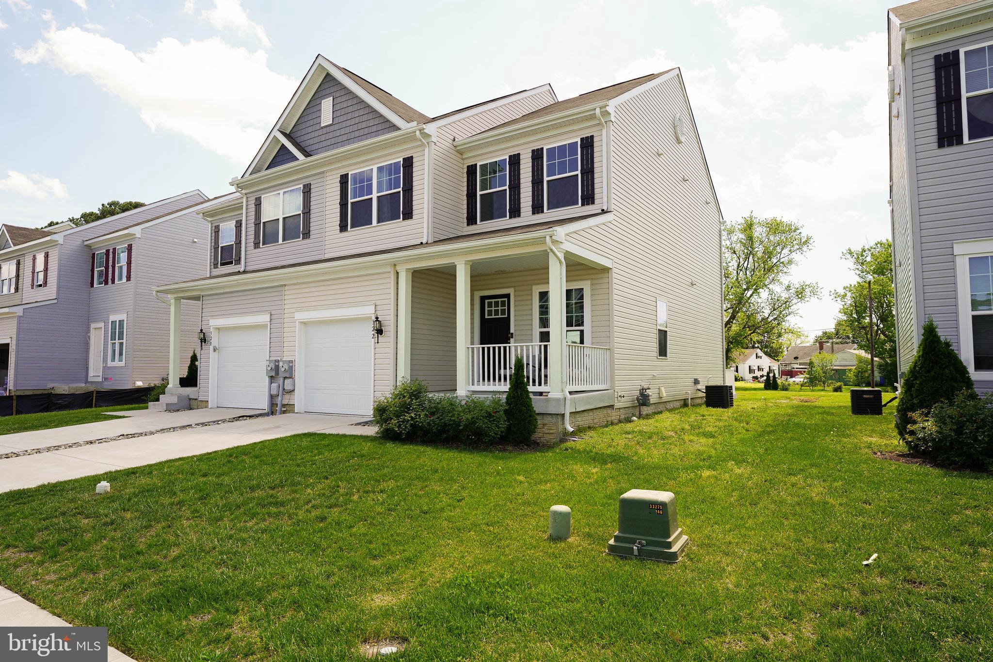 322 Appleby School Road Cambridge, MD 21613 - Photo 3 of 58 front view of a house with a yard