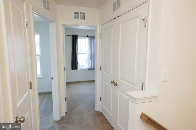 a bathroom with a shower and a glass door