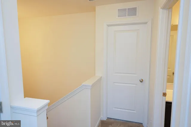 a bathroom with a double vanity sink and mirror
