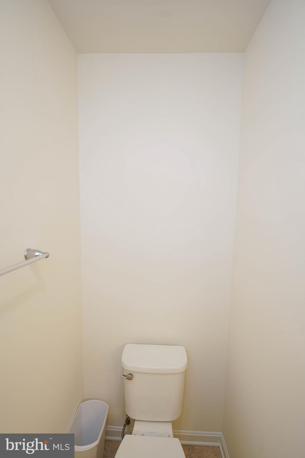 322 Appleby School Road Cambridge, MD 21613 - Photo 43 of 58 a white toilet sitting next to a white wall