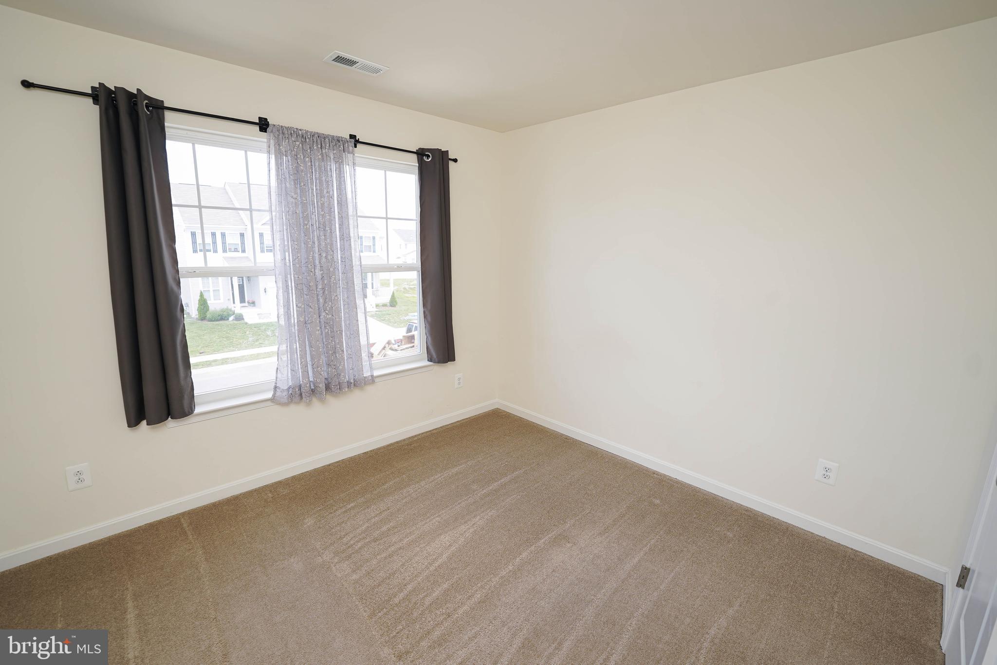 322 Appleby School Road Cambridge, MD 21613 - Photo 46 of 58 an empty room with a window