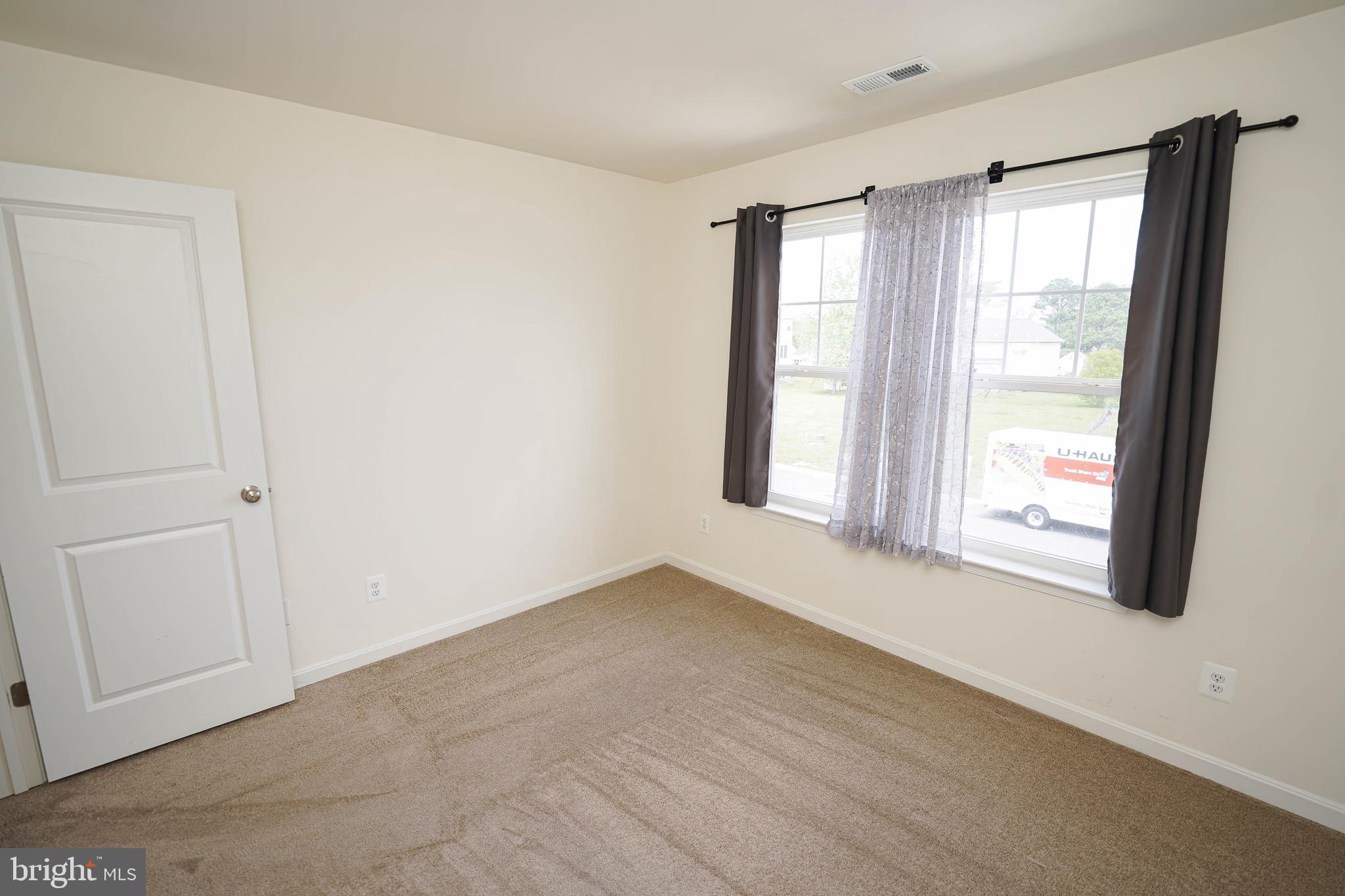 322 Appleby School Road Cambridge, MD 21613 - Photo 47 of 58 a view of an empty room with a window