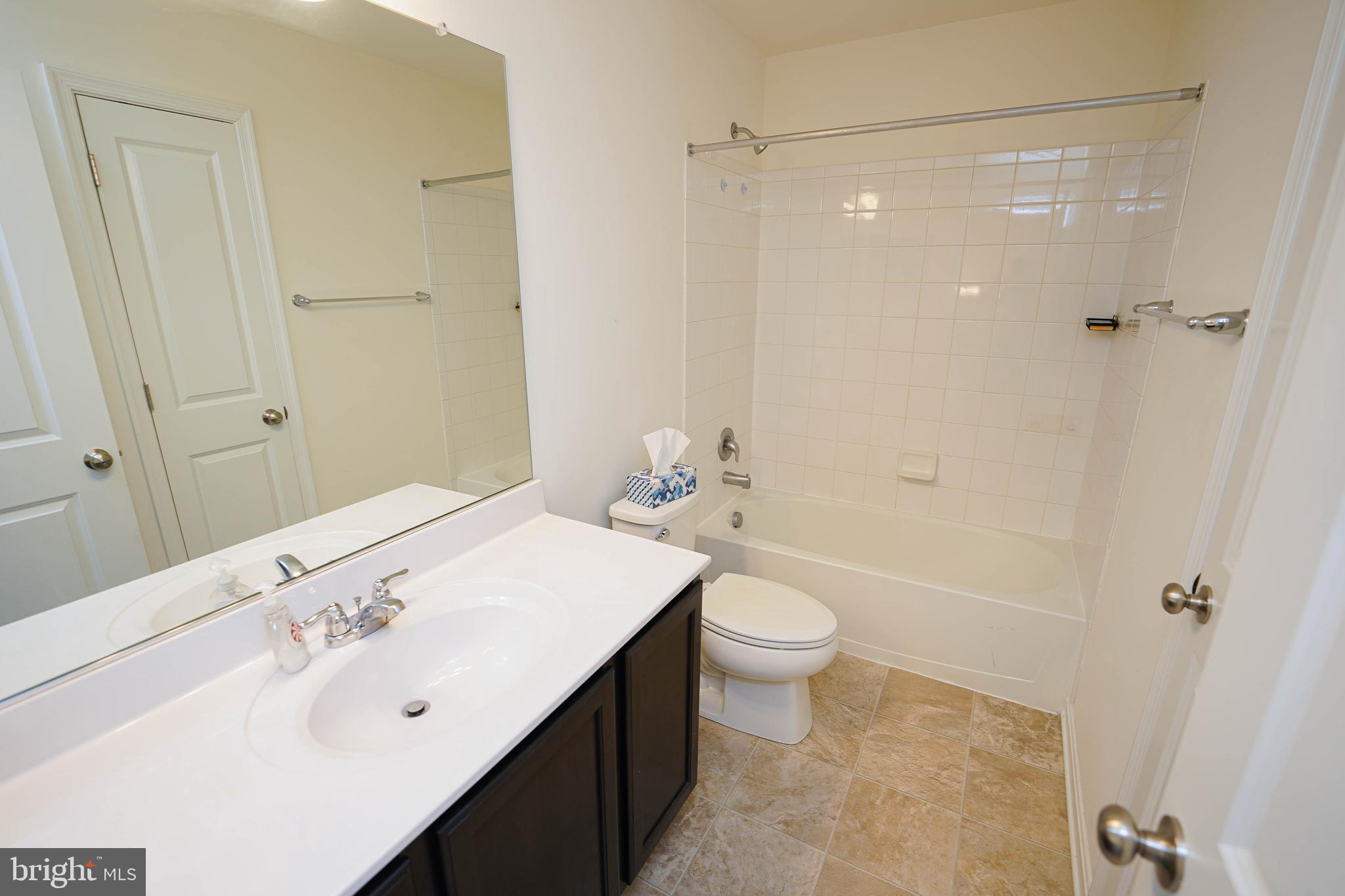 322 Appleby School Road Cambridge, MD 21613 - Photo 50 of 58 a bathroom with a sink a toilet and shower
