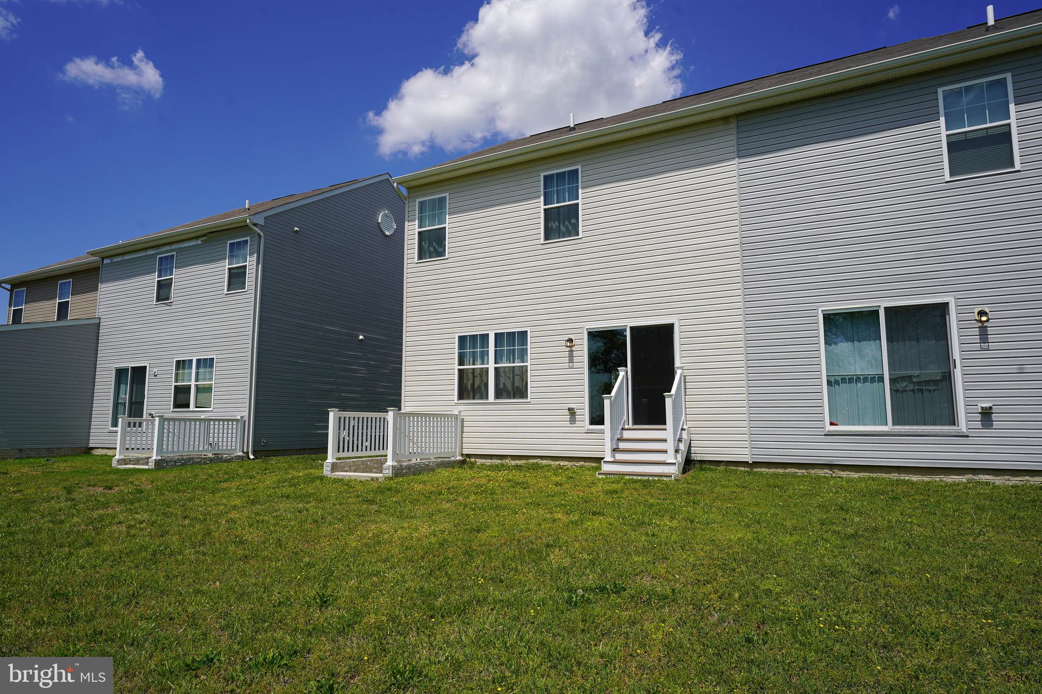 322 Appleby School Road Cambridge, MD 21613 - Photo 6 of 58 a backyard of a house with table and chairs