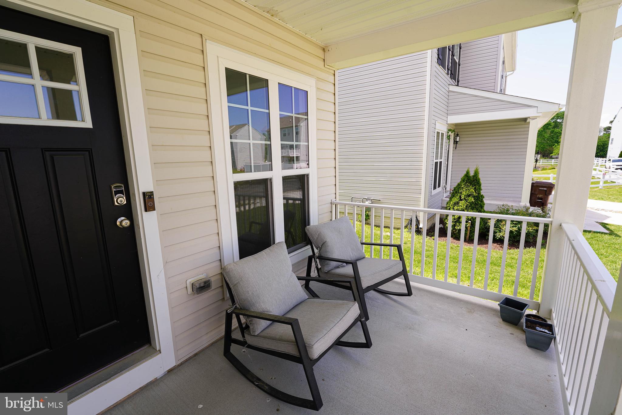 322 Appleby School Road Cambridge, MD 21613 - Photo 9 of 58 a view of a house with a chairs and table in a patio