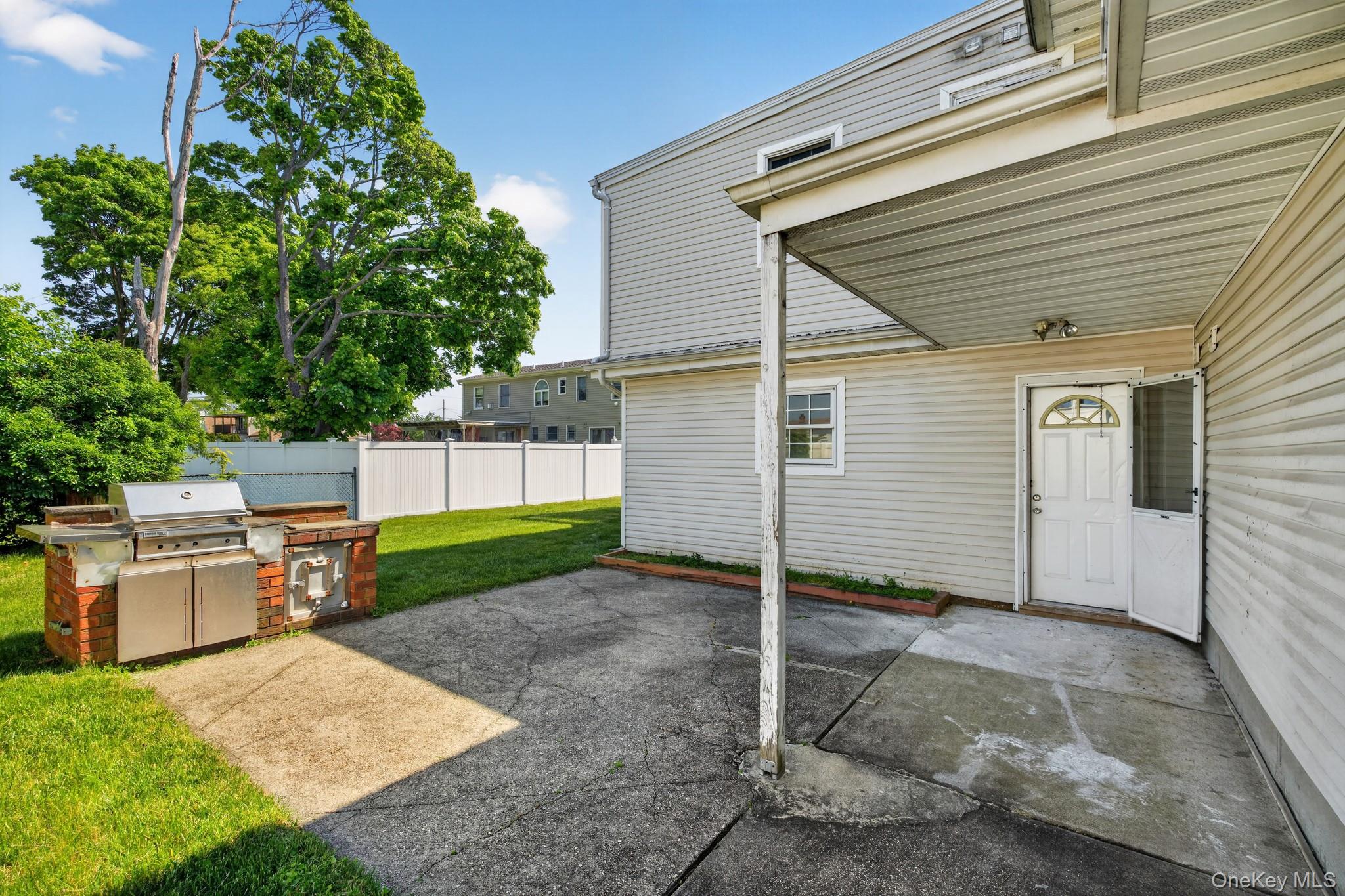 138 Spring Street Massapequa, NY 11758 - Photo 45 of 45 a view of backyard with a garden and entertaining space