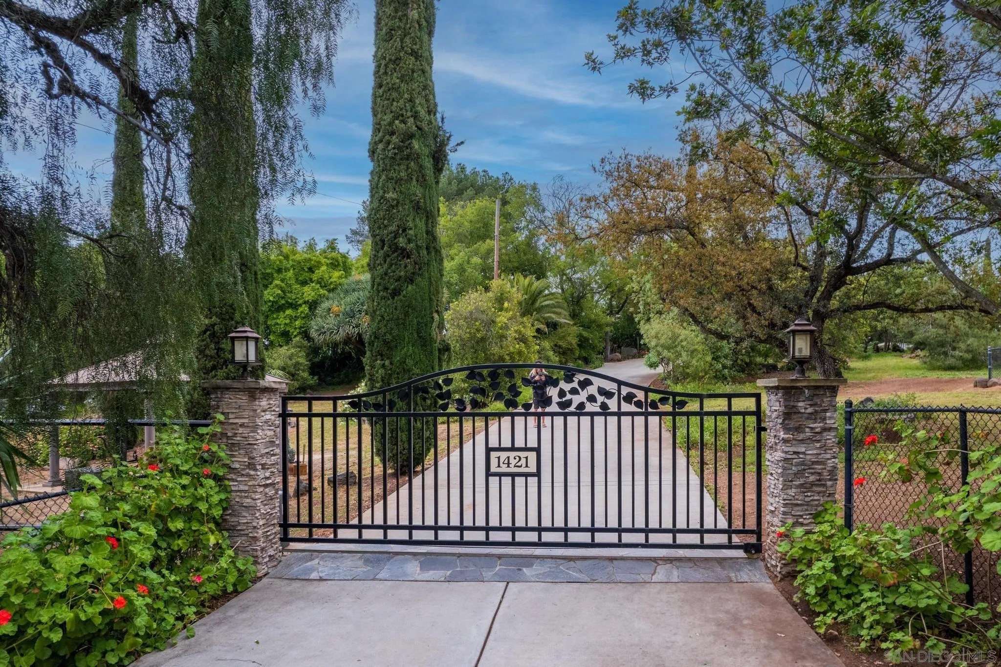 1421 South Grade Road Alpine, CA 91901 - Photo 4 of 59 a view of a wrought iron fences in front of house