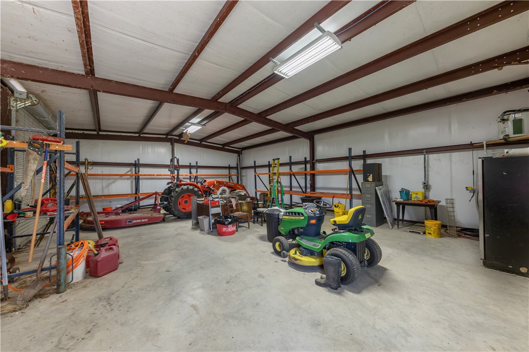 5732 Rose Hill Road Calvert, TX 77837 - Photo 15 of 46 a view of a garage with a bike and car