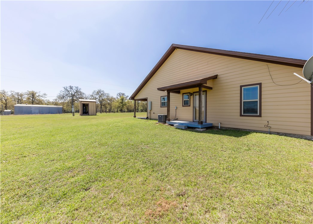 5732 Rose Hill Road Calvert, TX 77837 - Photo 18 of 46 a view of a house with a backyard